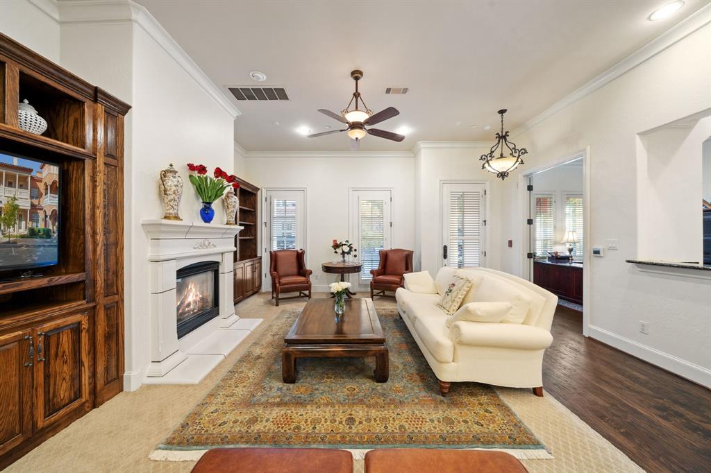34 Piazza Lane Colleyville, TX 76034 - Photo 3 of 38 a living room with furniture a fireplace and a flat screen tv