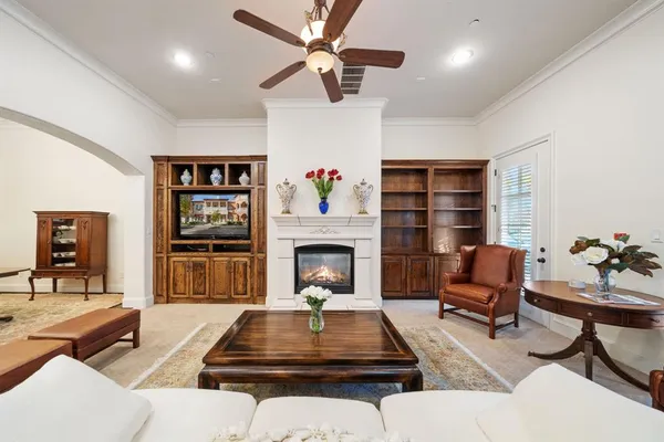 a living room with furniture and a fireplace
