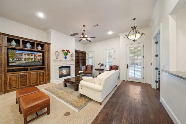a living room with furniture fireplace and flat screen tv