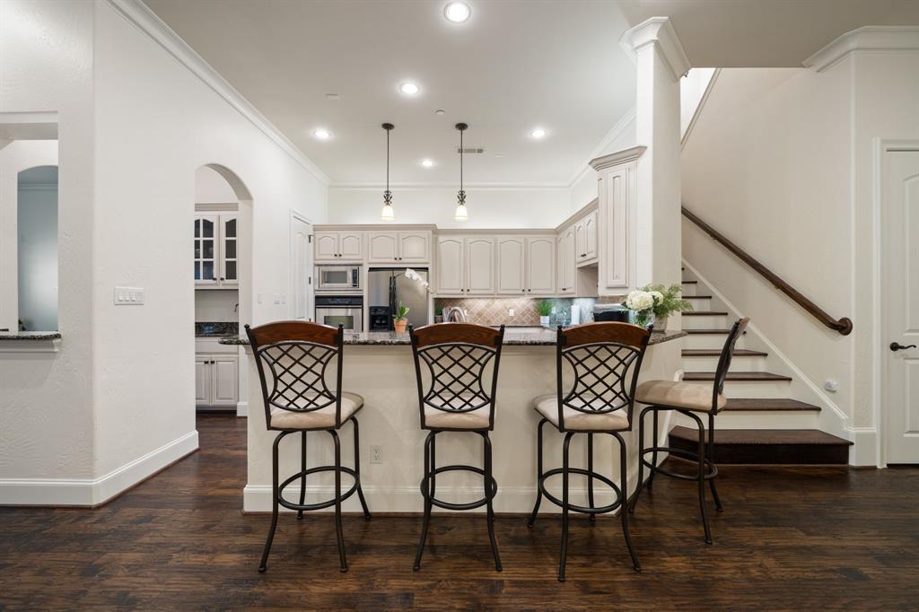 34 Piazza Lane Colleyville, TX 76034 - Photo 9 of 38 a view of a dining room with furniture and wooden floor