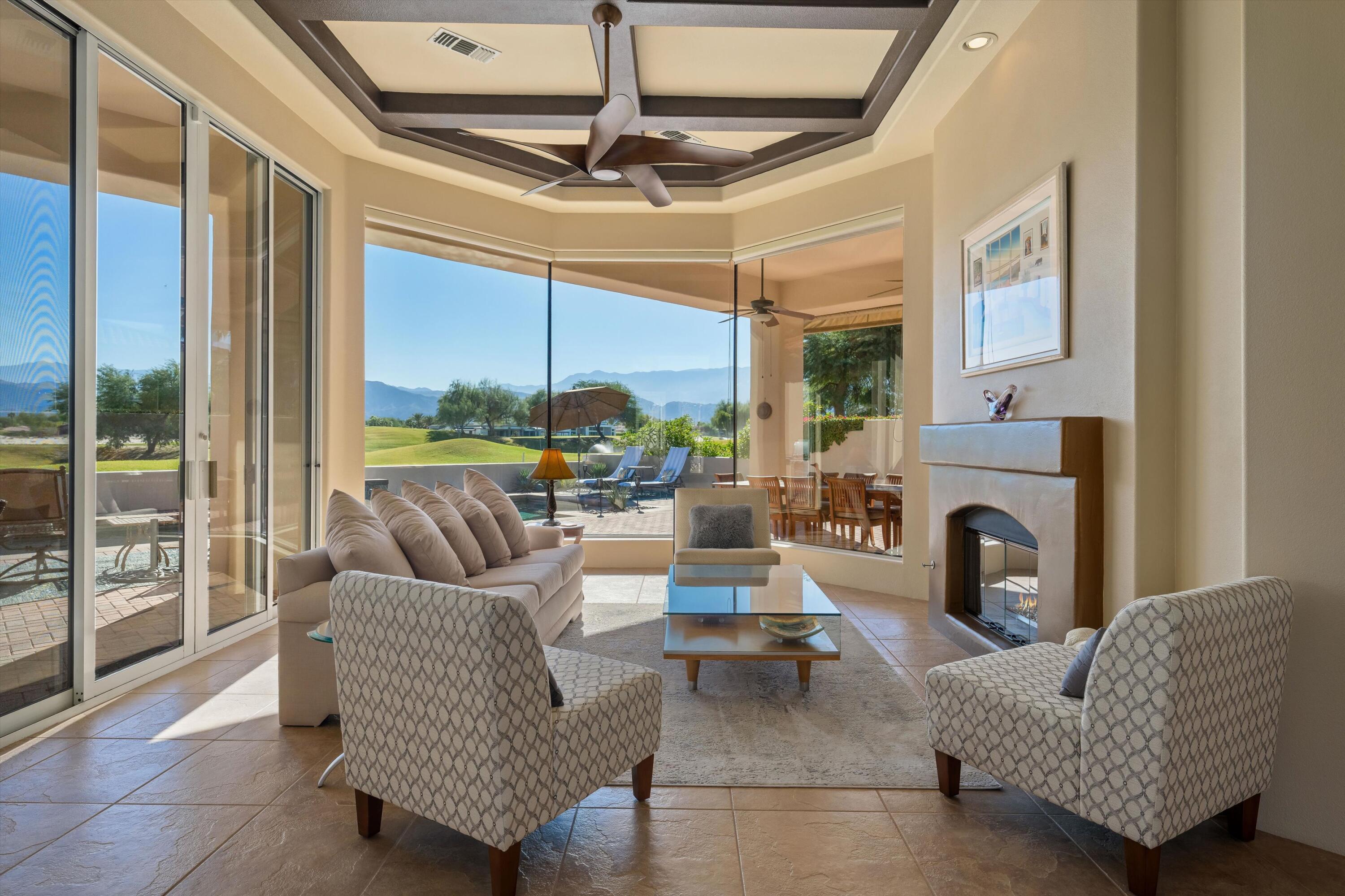 270 Loch Lomond Road Rancho Mirage, CA 92270 - Photo 1 of 51 a living room with furniture and a fireplace