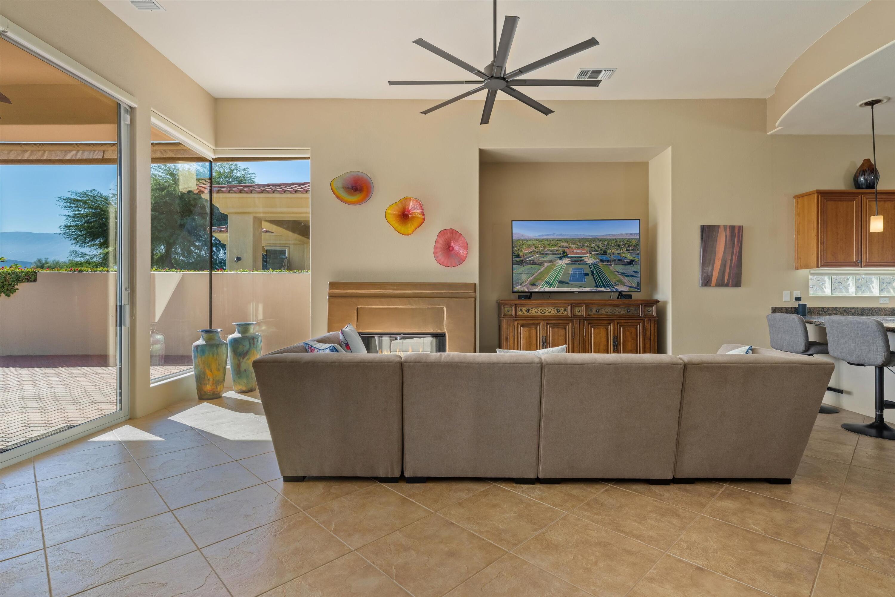 270 Loch Lomond Road Rancho Mirage, CA 92270 - Photo 12 of 51 a living room with furniture and a flat screen tv