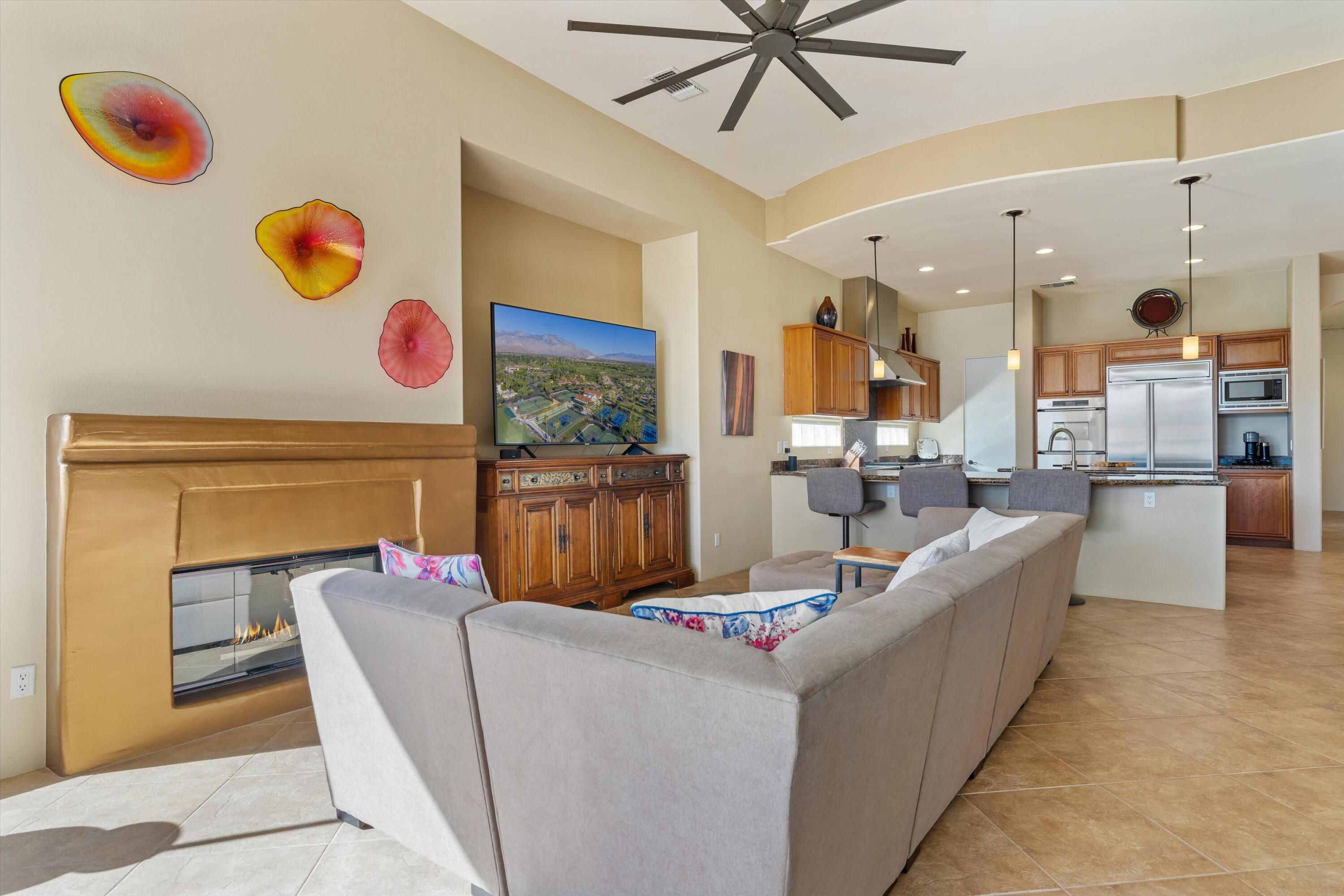 270 Loch Lomond Road Rancho Mirage, CA 92270 - Photo 13 of 51 a living room with furniture and a wall painting