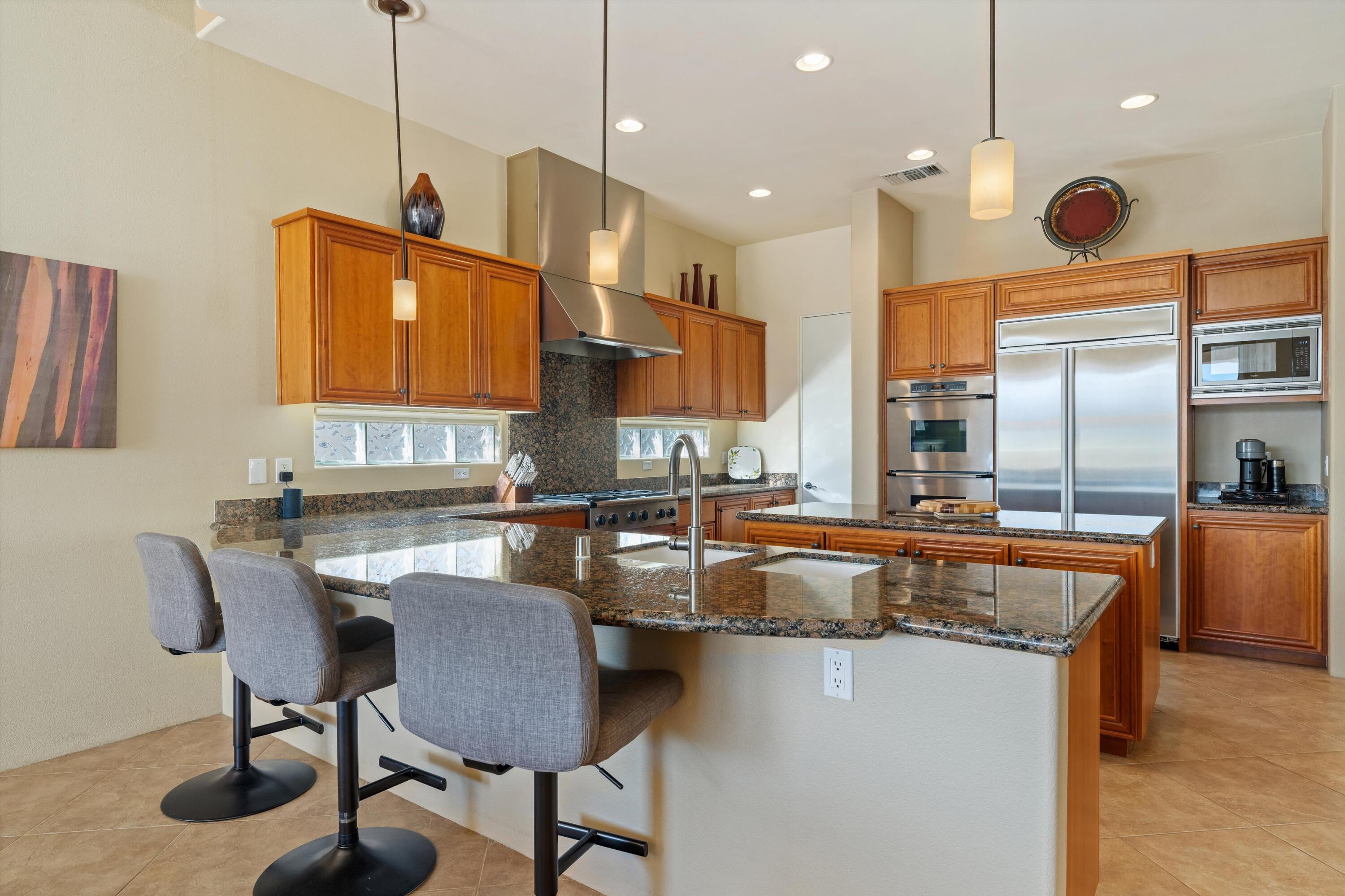 270 Loch Lomond Road Rancho Mirage, CA 92270 - Photo 14 of 51 a kitchen with counter space appliances and a window