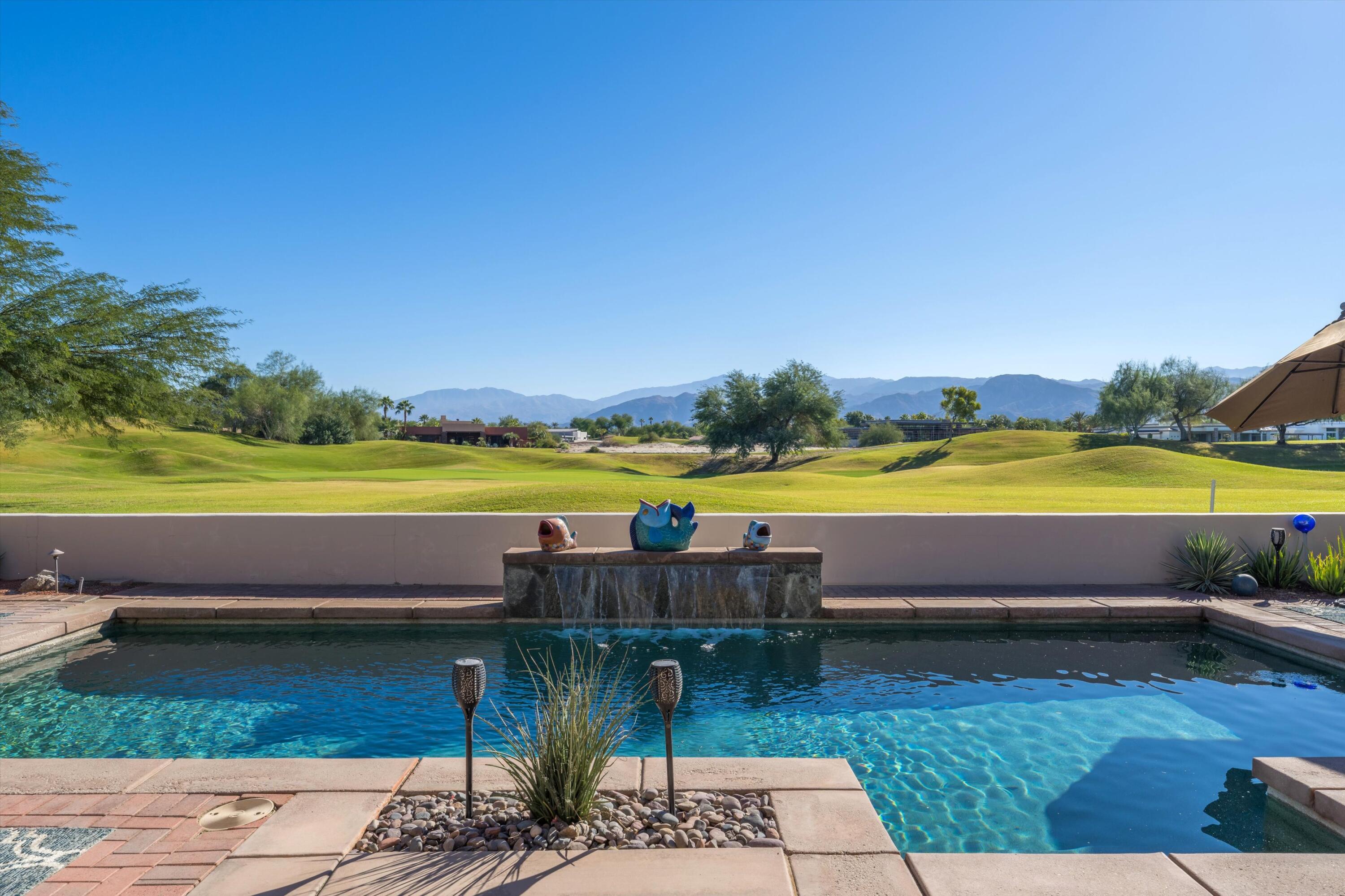 270 Loch Lomond Road Rancho Mirage, CA 92270 - Photo 2 of 51 a view of swimming pool with outdoor space and seating area