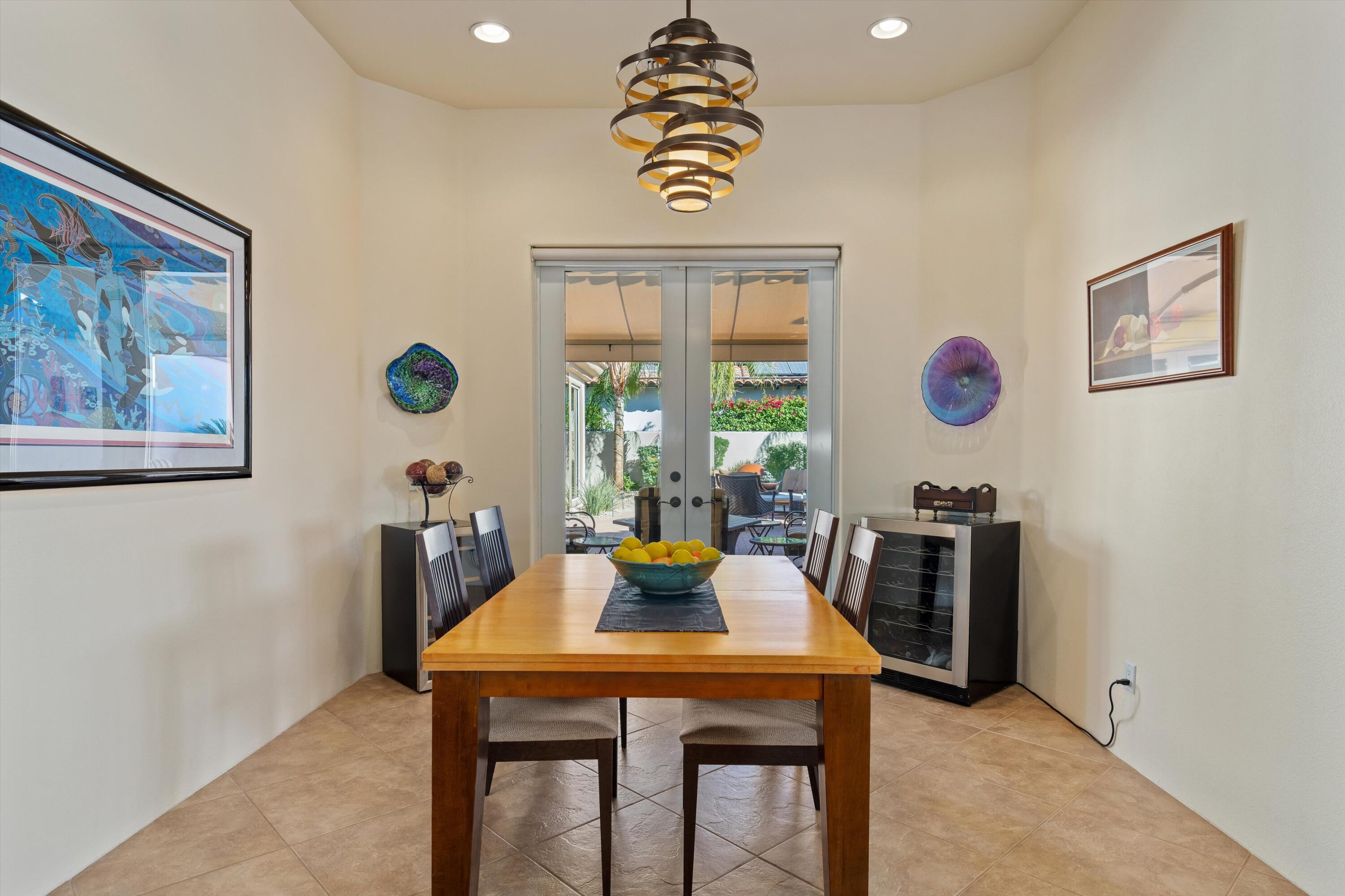 270 Loch Lomond Road Rancho Mirage, CA 92270 - Photo 21 of 51 a view of a dining room with furniture window and outside view