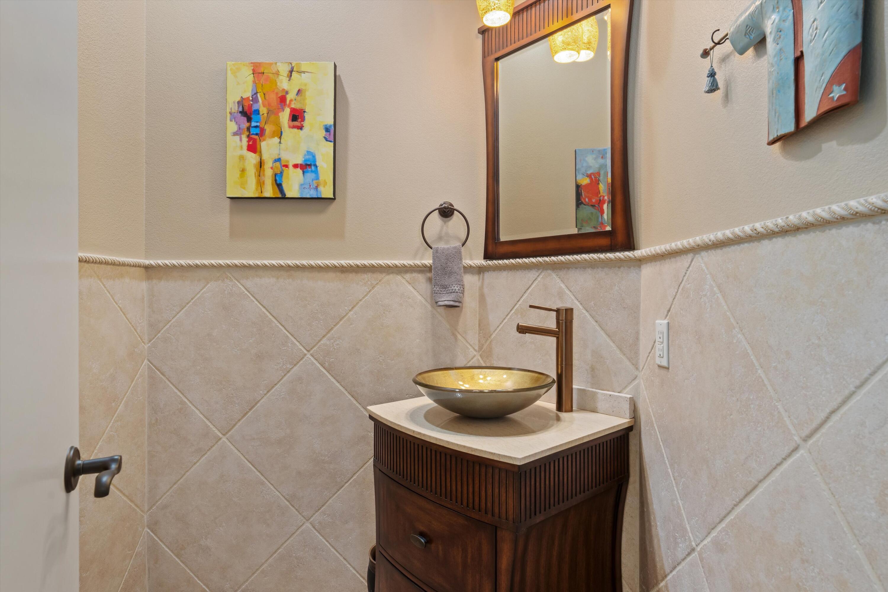 270 Loch Lomond Road Rancho Mirage, CA 92270 - Photo 22 of 51 a bathroom with a sink and a mirror