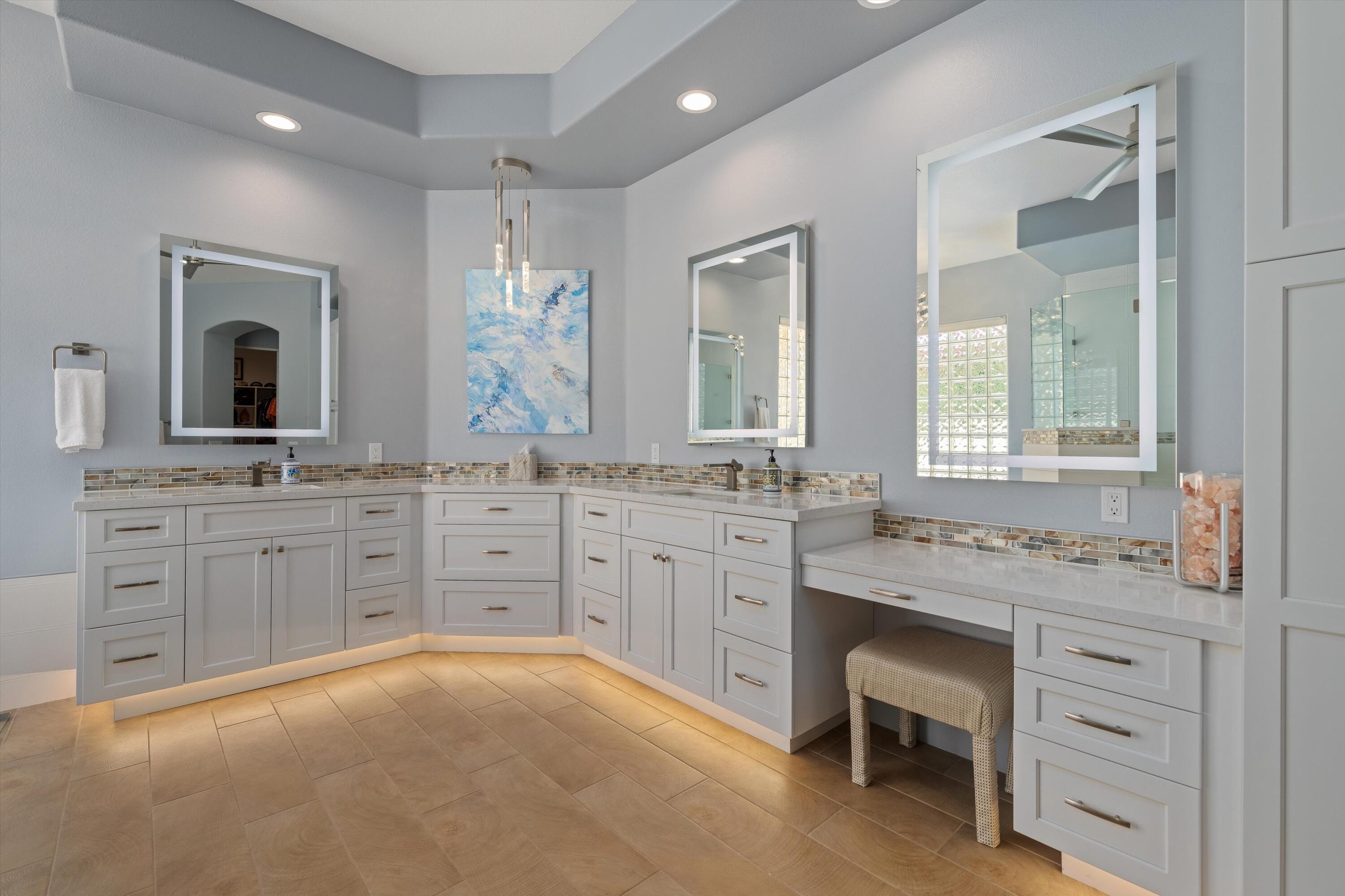 270 Loch Lomond Road Rancho Mirage, CA 92270 - Photo 27 of 51 a bathroom with a granite countertop sink mirror and cabinets