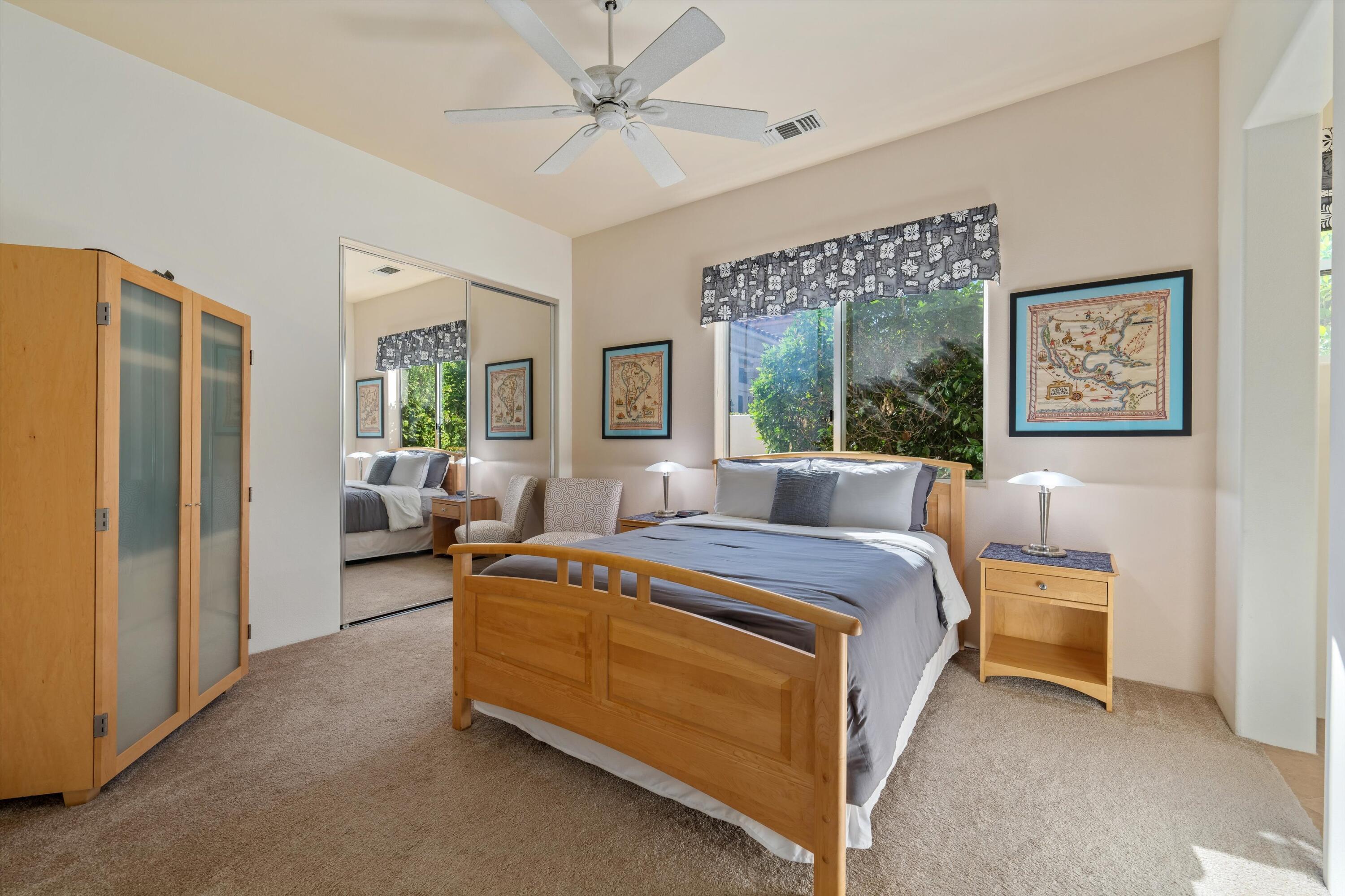 270 Loch Lomond Road Rancho Mirage, CA 92270 - Photo 30 of 51 a bed room with a bed and a couch