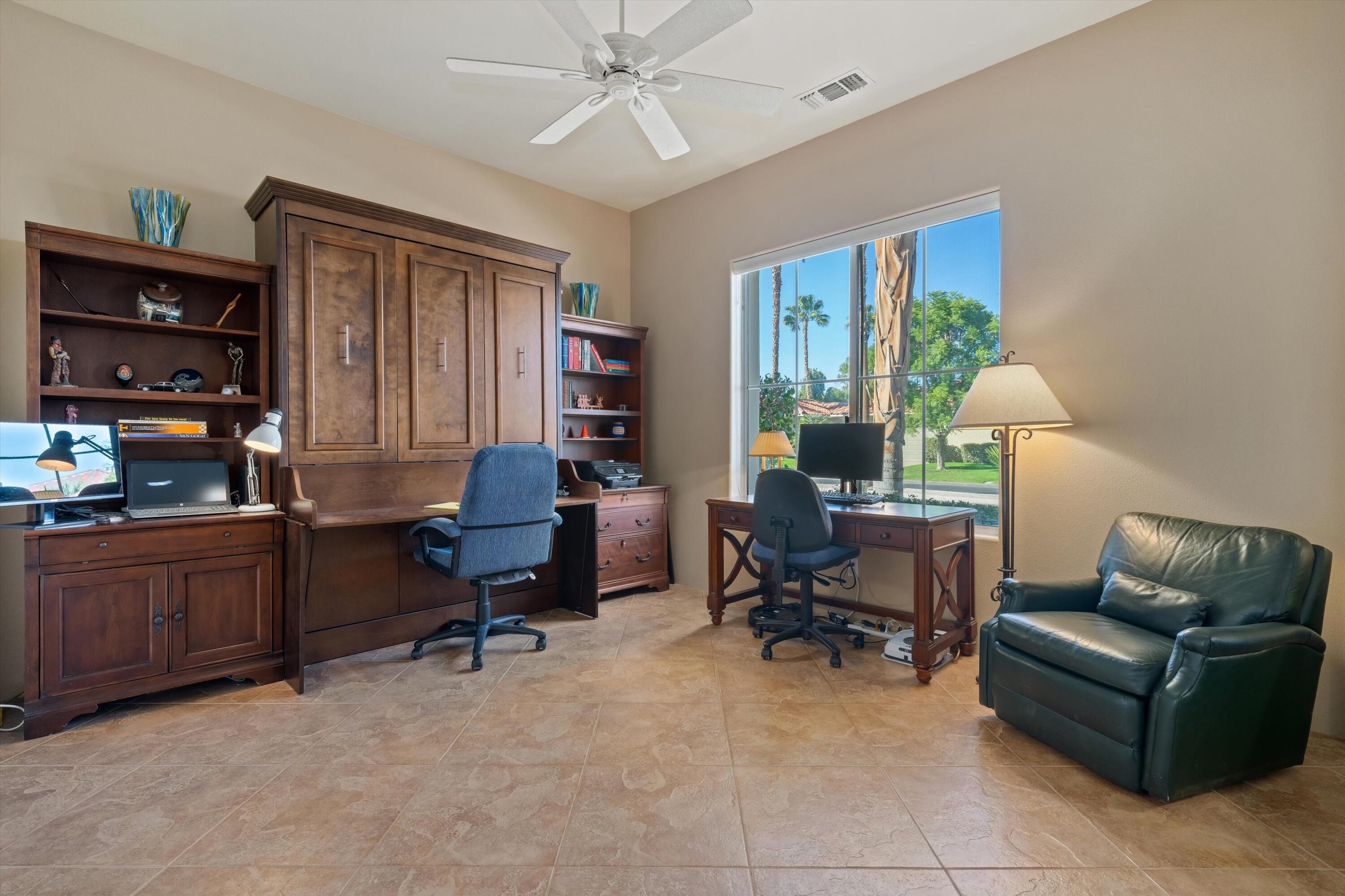 270 Loch Lomond Road Rancho Mirage, CA 92270 - Photo 32 of 51 a view of a livingroom with workspace and a window
