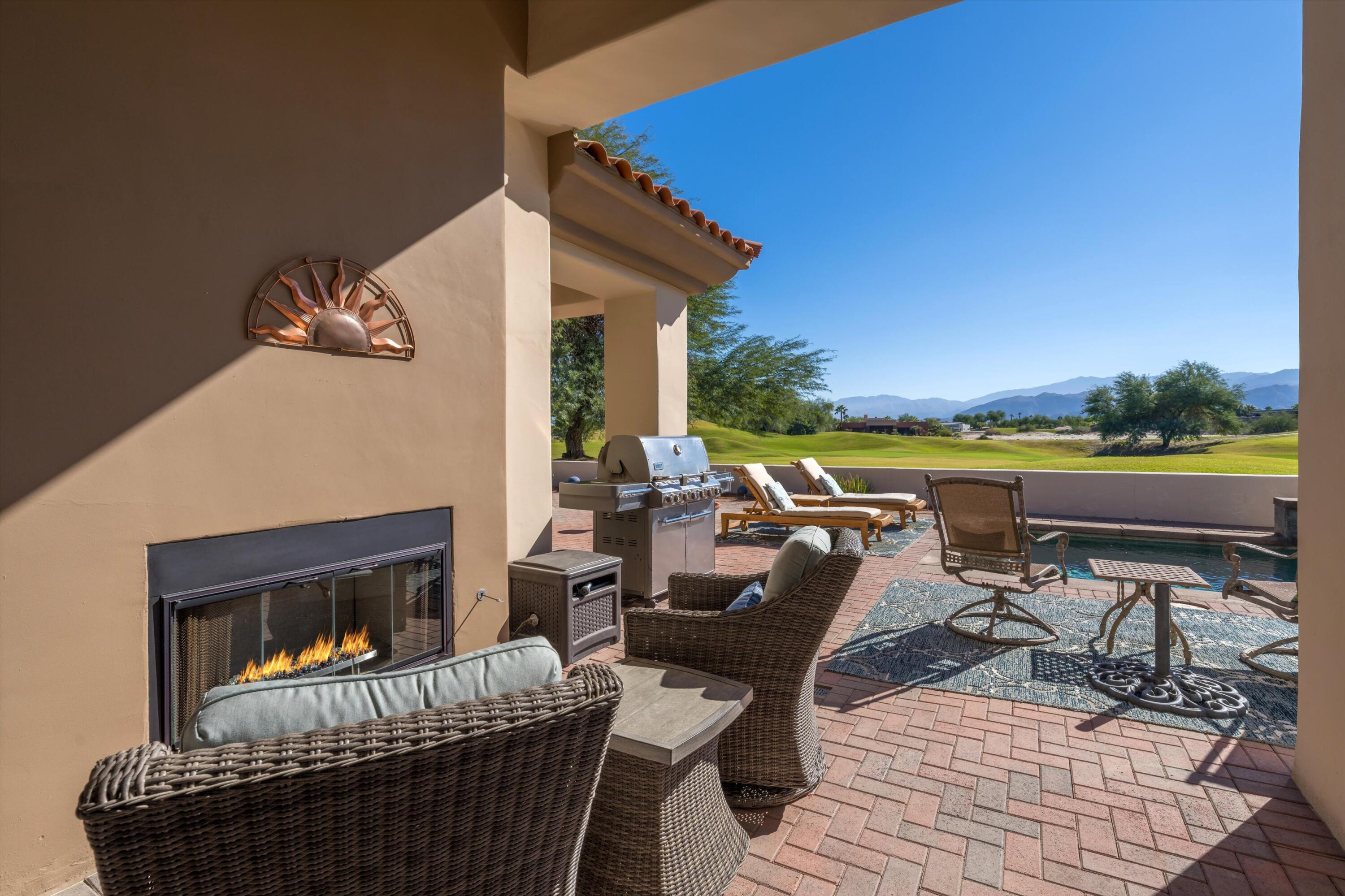 270 Loch Lomond Road Rancho Mirage, CA 92270 - Photo 33 of 51 swimming pool view with a seating space