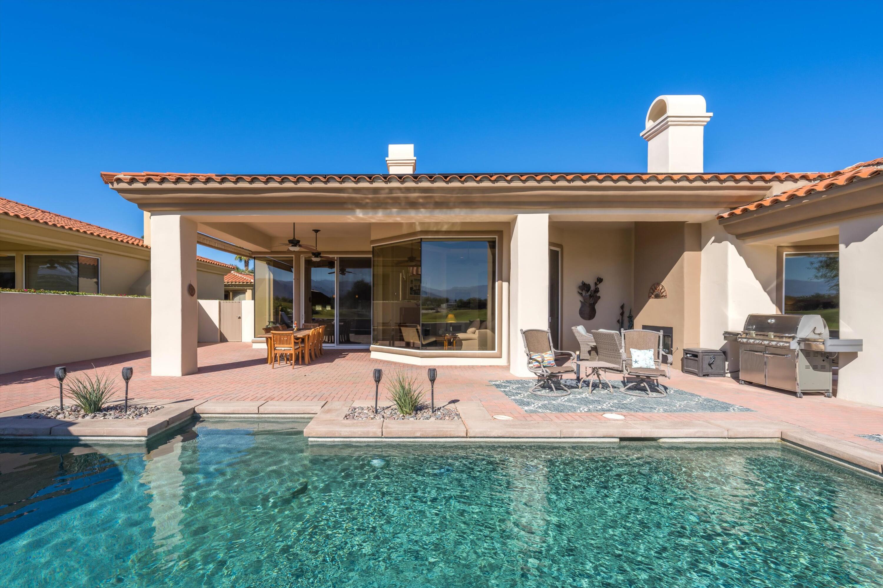 270 Loch Lomond Road Rancho Mirage, CA 92270 - Photo 35 of 51 a view of a house with backyard porch and outdoor seating