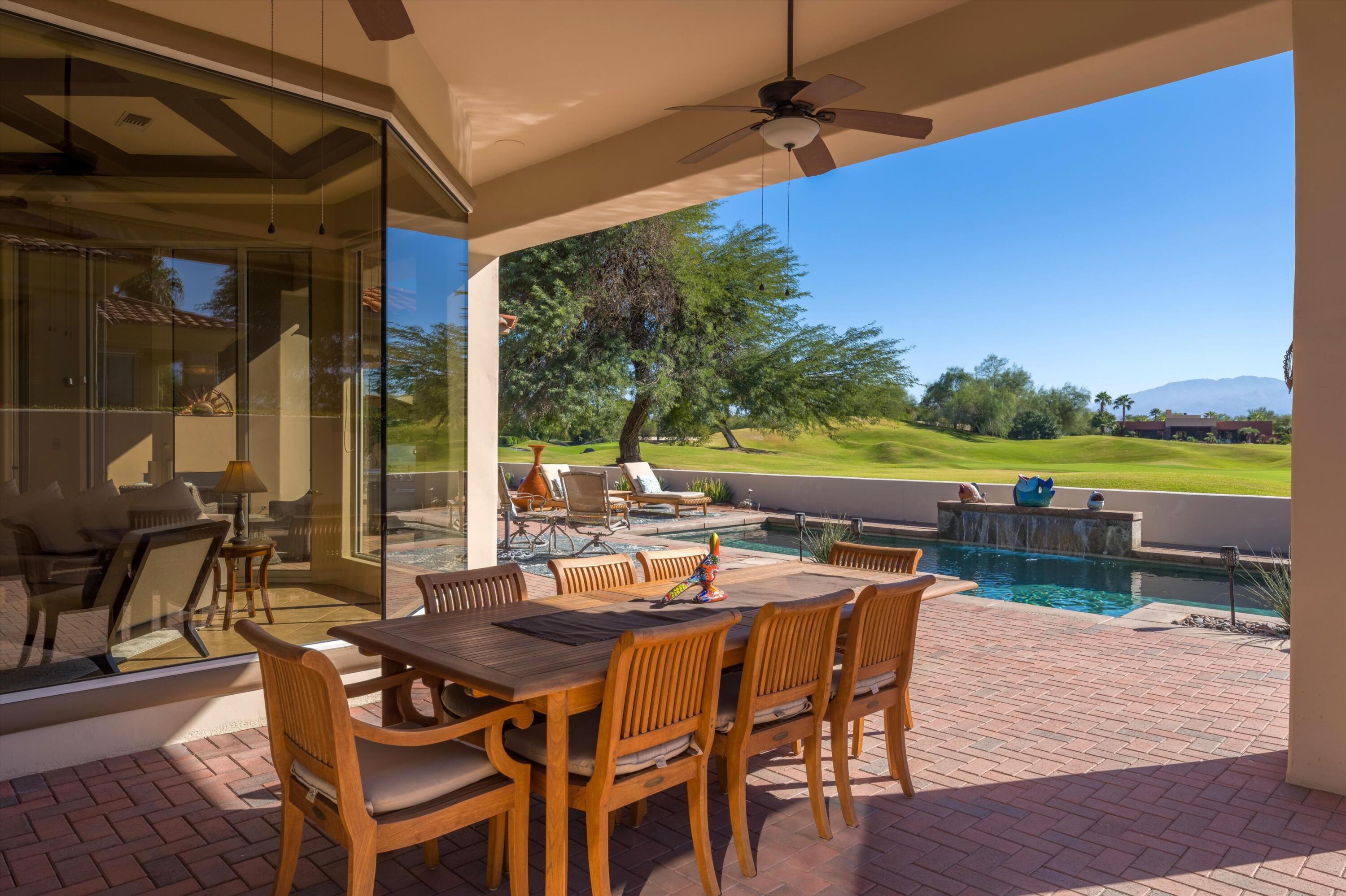 270 Loch Lomond Road Rancho Mirage, CA 92270 - Photo 36 of 51 a view of an outside dining space with furniture and garden