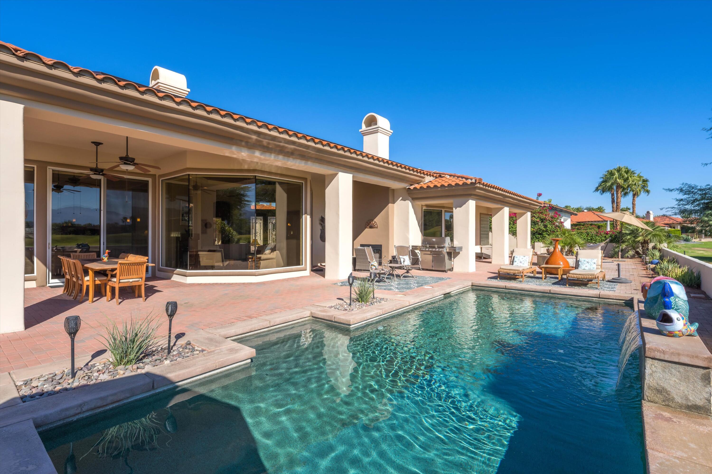 270 Loch Lomond Road Rancho Mirage, CA 92270 - Photo 38 of 51 a view of a house with swimming pool and sitting area