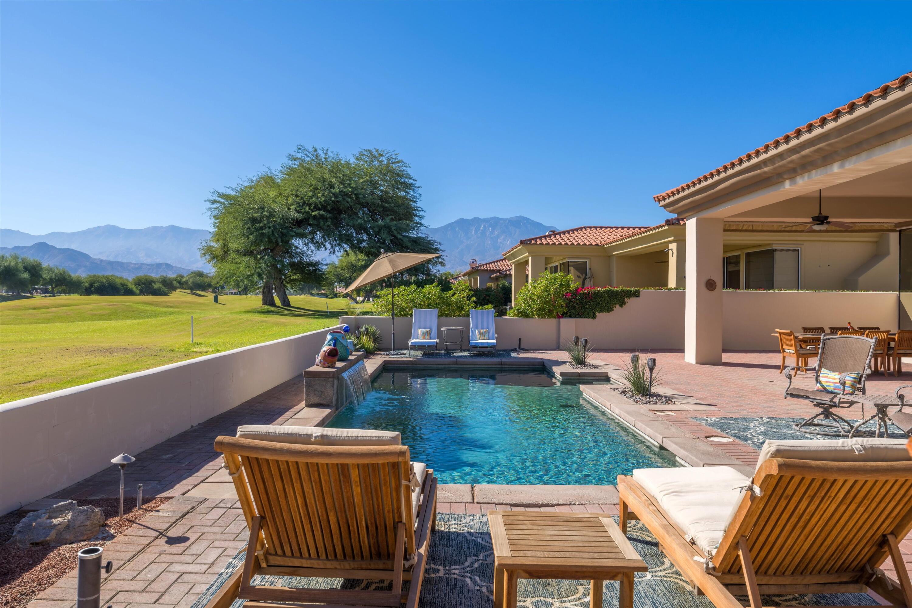 270 Loch Lomond Road Rancho Mirage, CA 92270 - Photo 41 of 51 a view of a patio with chairs and a table
