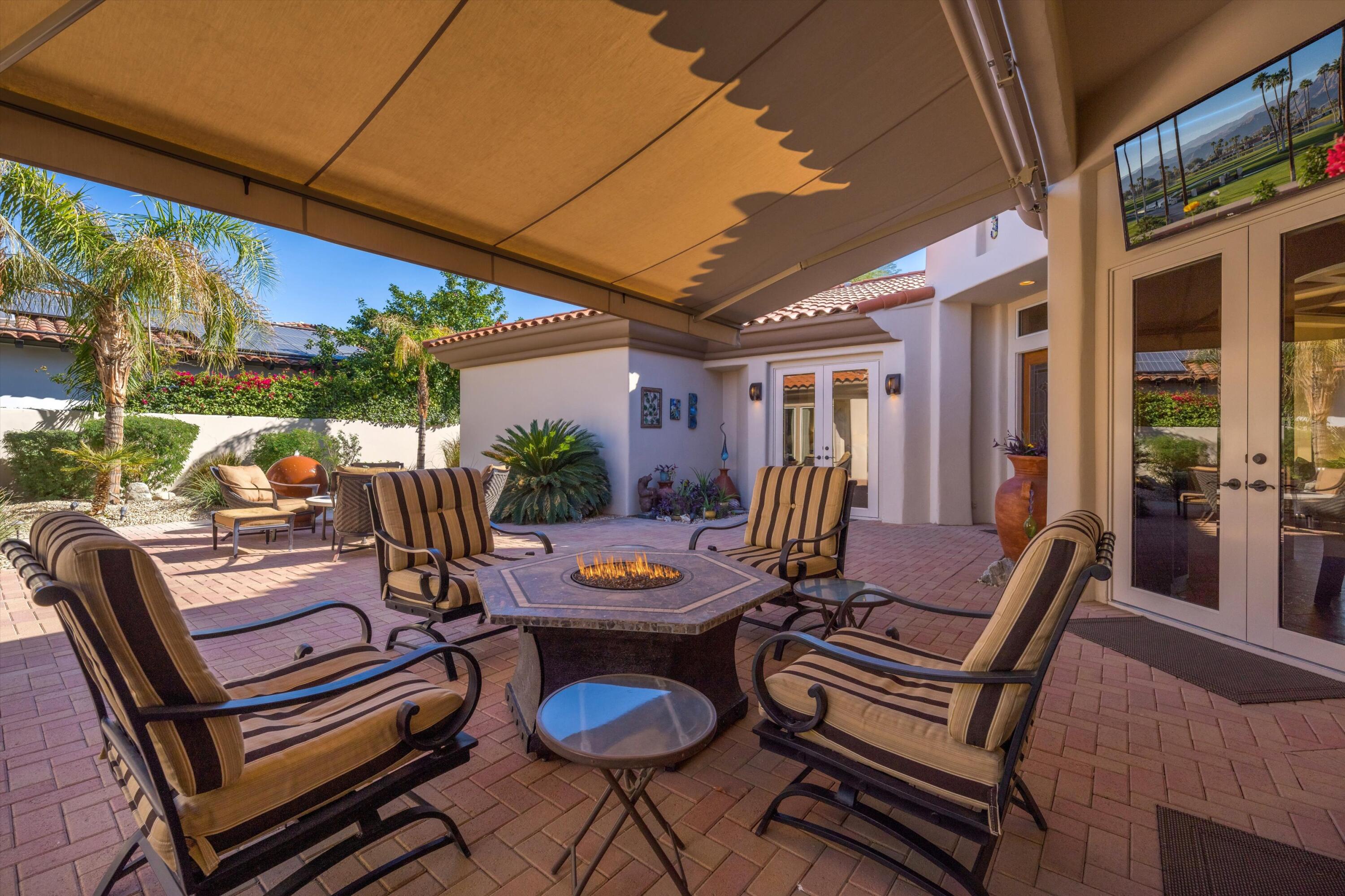 270 Loch Lomond Road Rancho Mirage, CA 92270 - Photo 6 of 51 a view of a patio with couple of chairs and a table