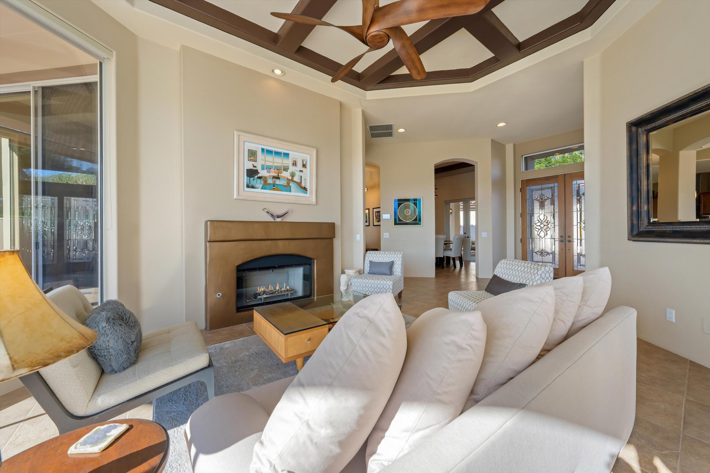 270 Loch Lomond Road Rancho Mirage, CA 92270 - Photo 8 of 51 a living room with furniture and a fireplace