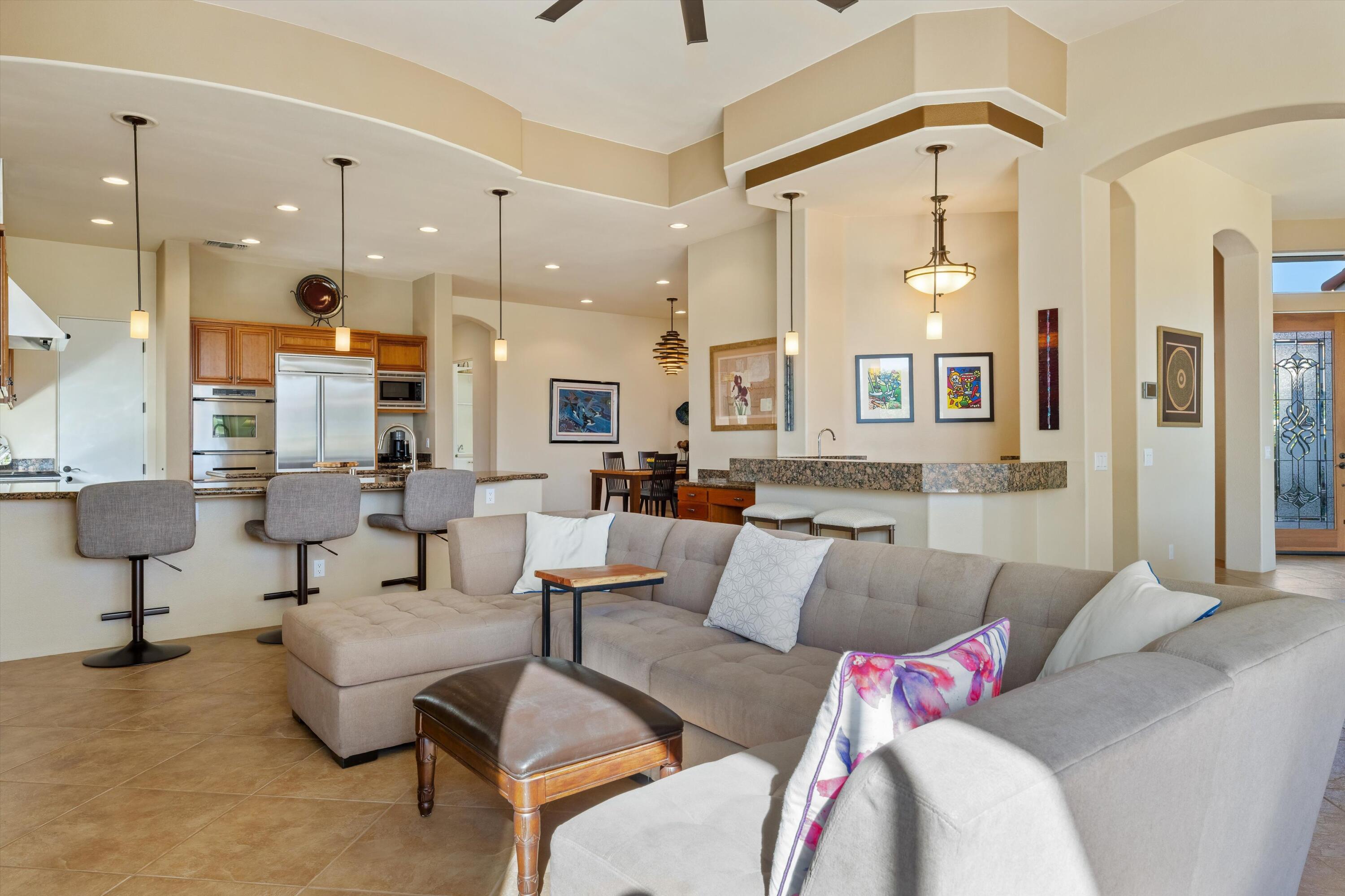 270 Loch Lomond Road Rancho Mirage, CA 92270 - Photo 9 of 51 a living room with furniture and a large window