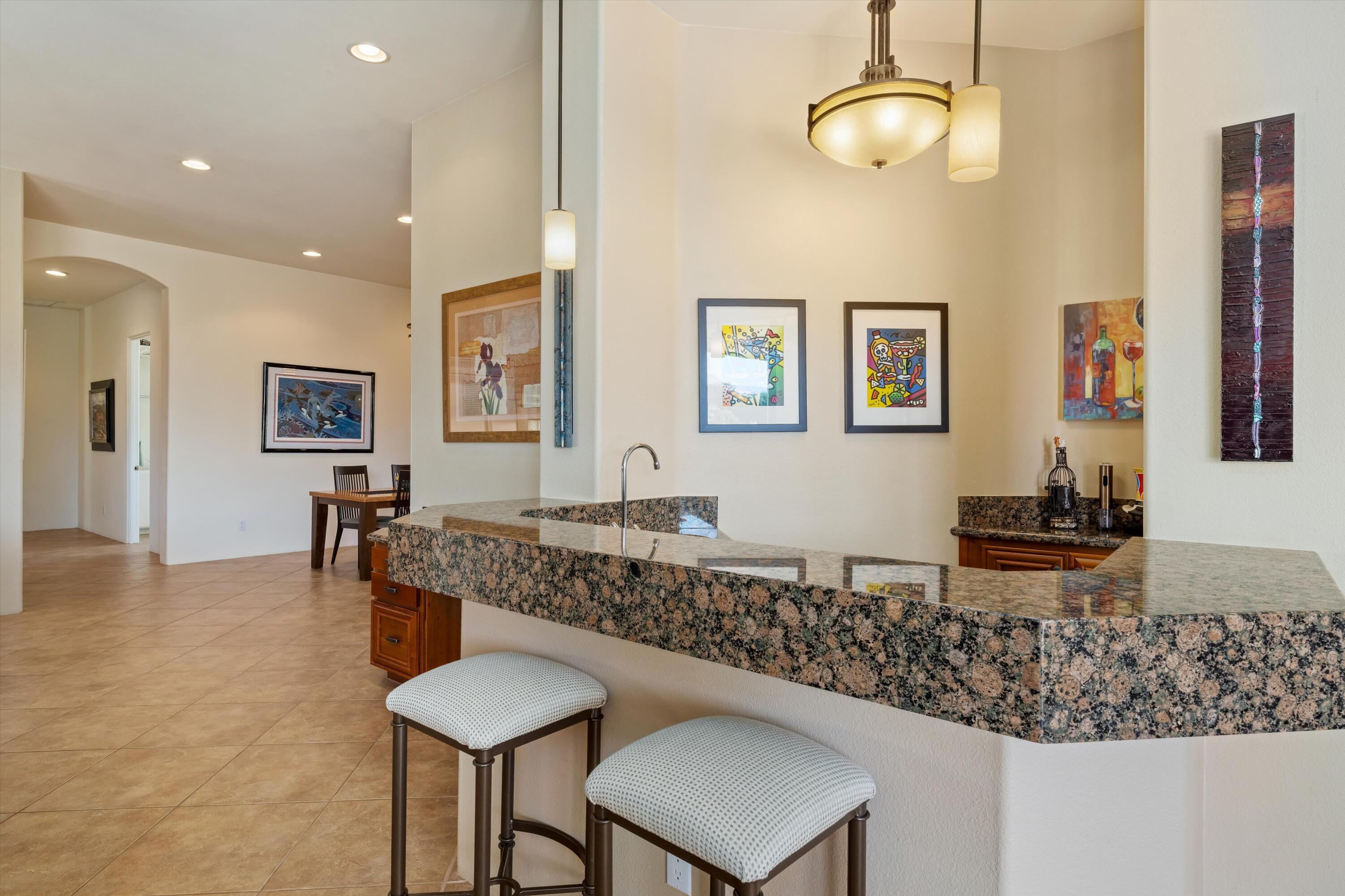 270 Loch Lomond Road Rancho Mirage, CA 92270 - Photo 10 of 51 a room with granite countertop furniture and a chandelier