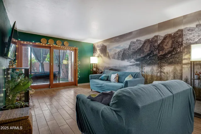 a living room with furniture and a large window