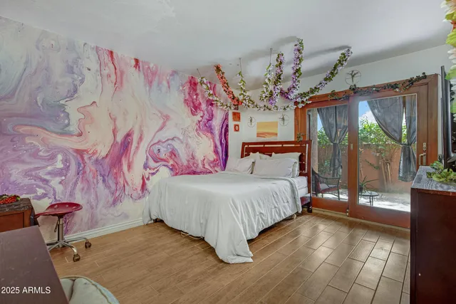 a bedroom with a bed and window