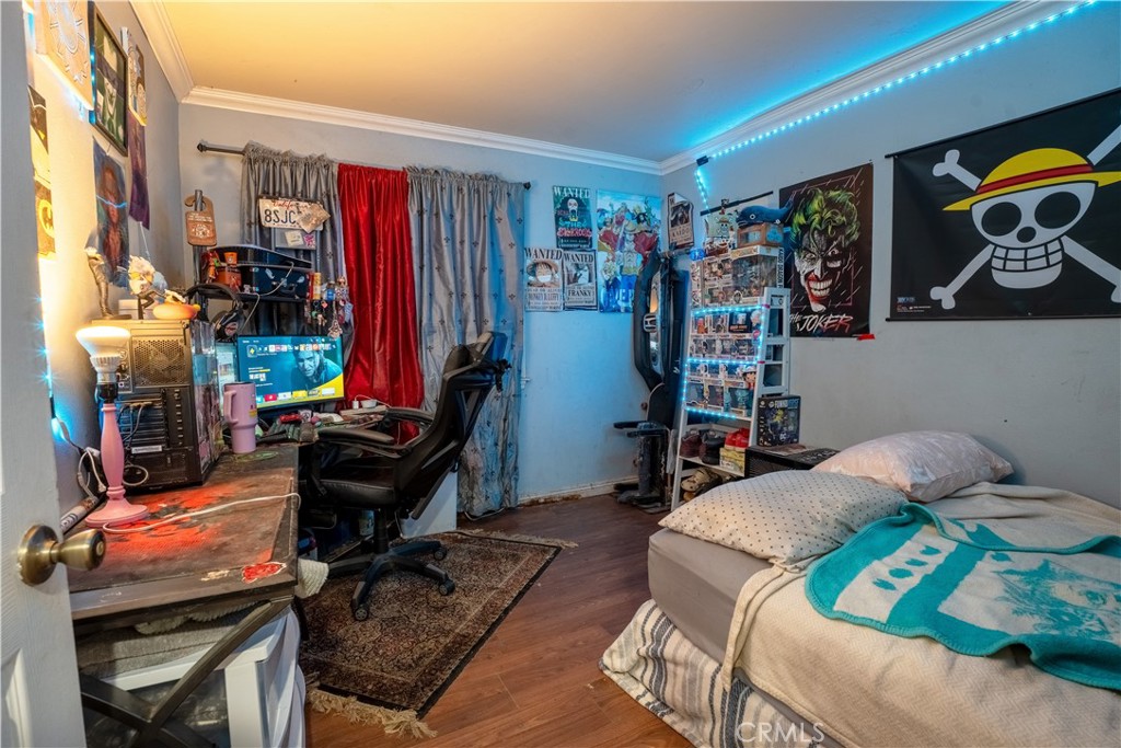 21329 Tennyson Road Moreno Valley, CA 92557 - Photo 15 of 32 a living room with lots of furniture and clothes