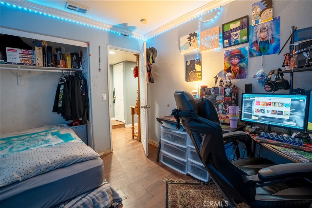 21329 Tennyson Road Moreno Valley, CA 92557 - Photo 16 of 32 a living room with furniture and a book shelf