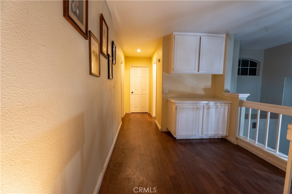 21329 Tennyson Road Moreno Valley, CA 92557 - Photo 17 of 32 a view of hallway with wooden floor