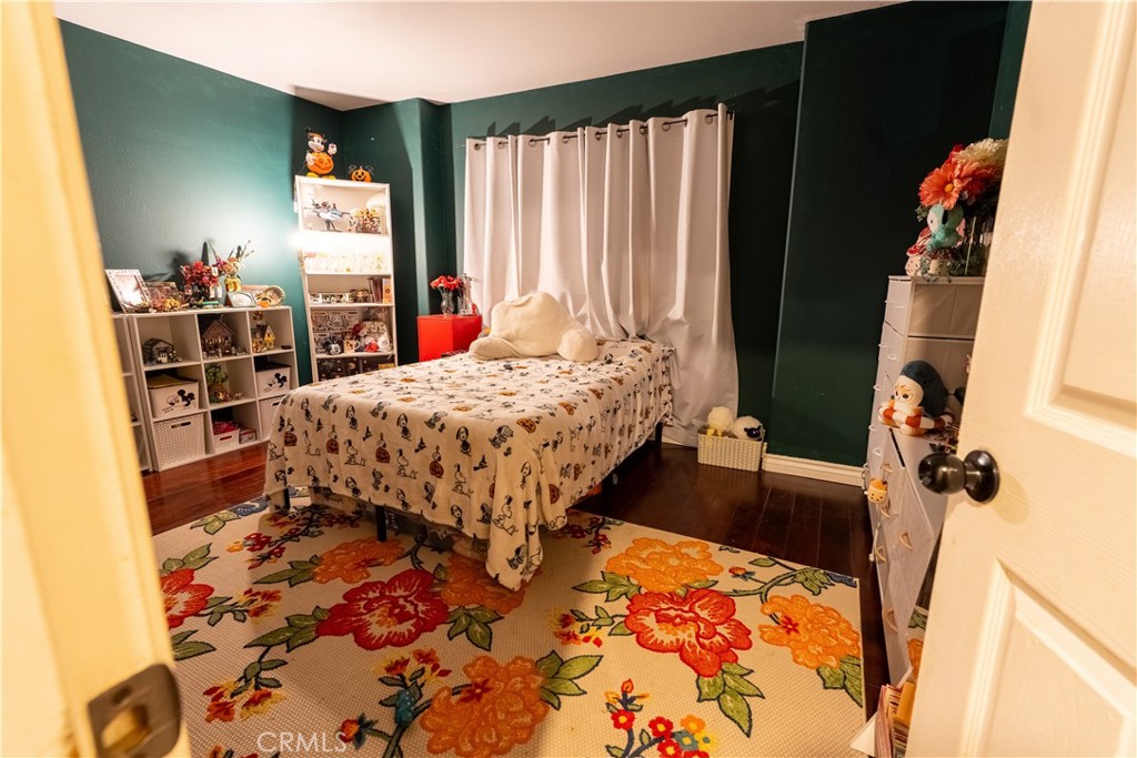 21329 Tennyson Road Moreno Valley, CA 92557 - Photo 18 of 32 a bed sitting in a bedroom next to a window