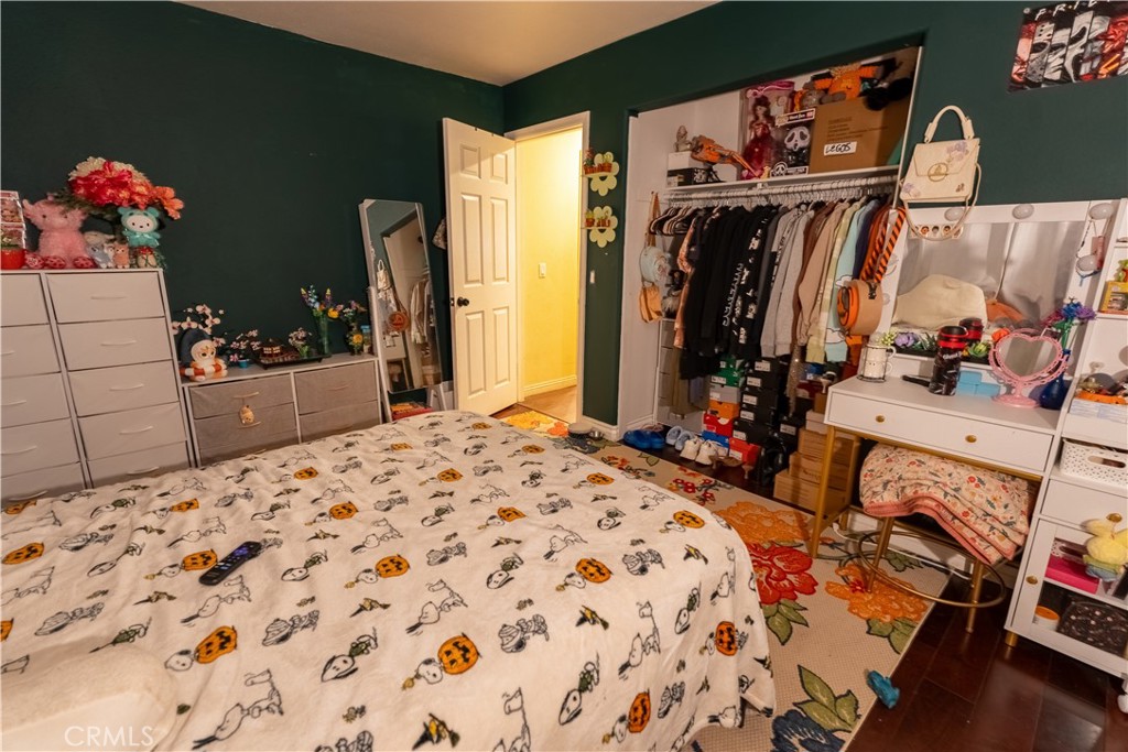 21329 Tennyson Road Moreno Valley, CA 92557 - Photo 19 of 32 a bed room with a bed and a view of bathroom