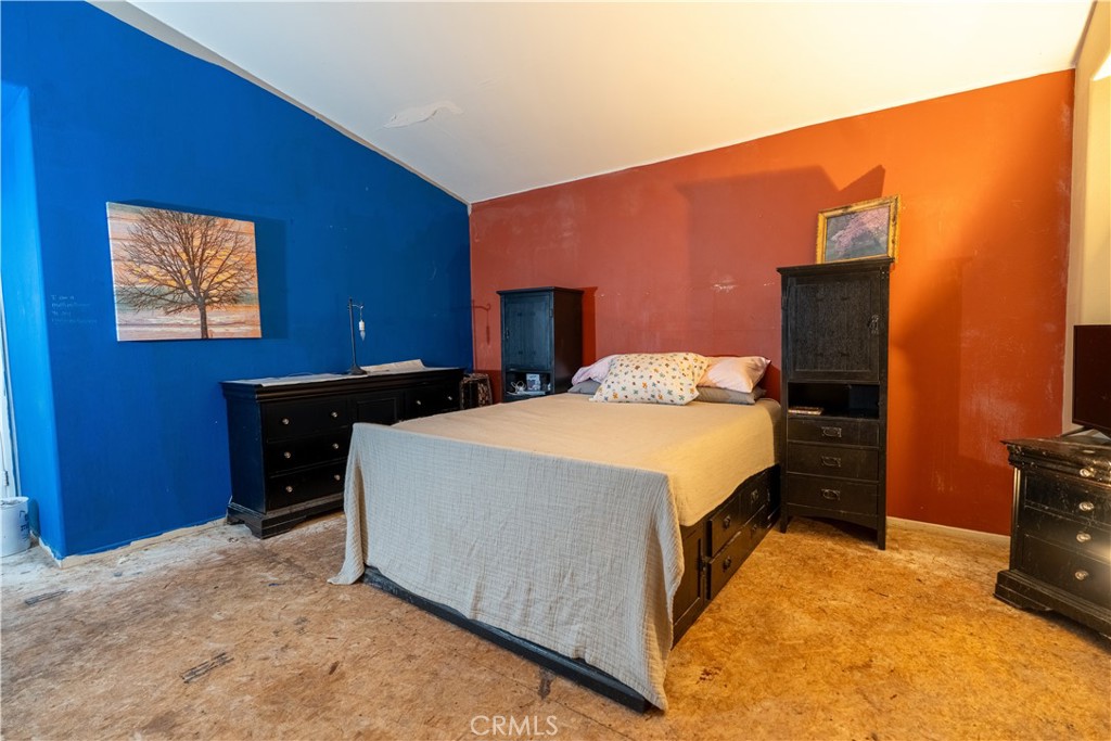 21329 Tennyson Road Moreno Valley, CA 92557 - Photo 26 of 32 a bedroom with a bed and a television