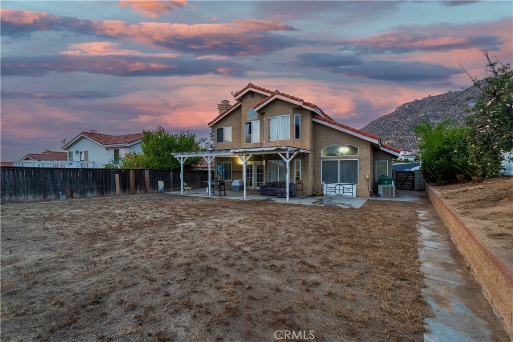 21329 Tennyson Road Moreno Valley, CA 92557 - Photo 31 of 32 a front view of a house with a garden