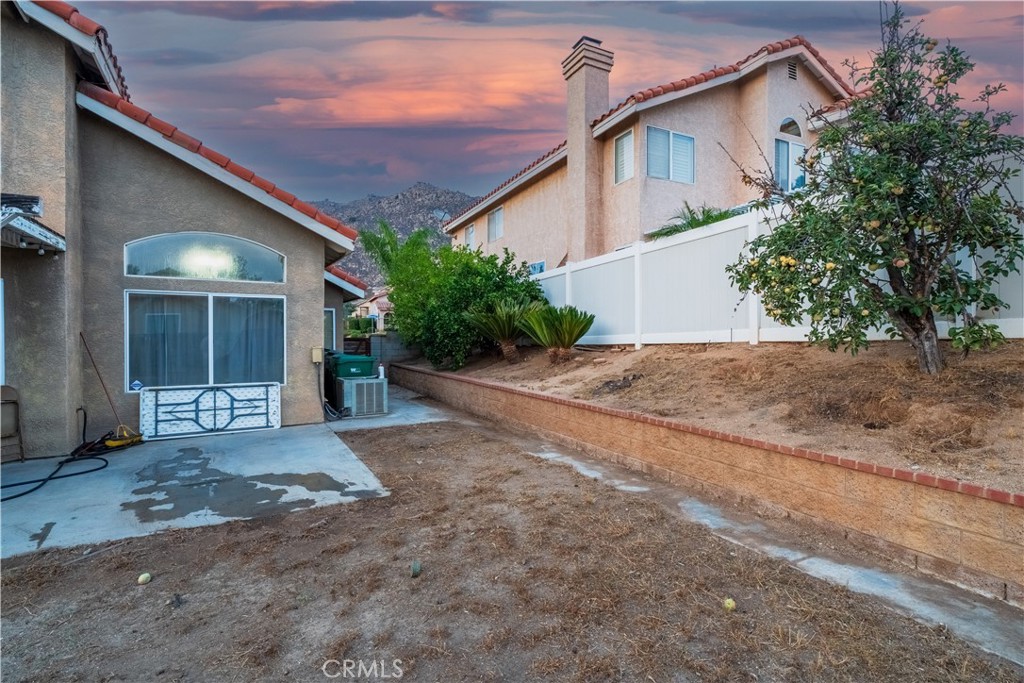 21329 Tennyson Road Moreno Valley, CA 92557 - Photo 32 of 32 a view of a house with a patio