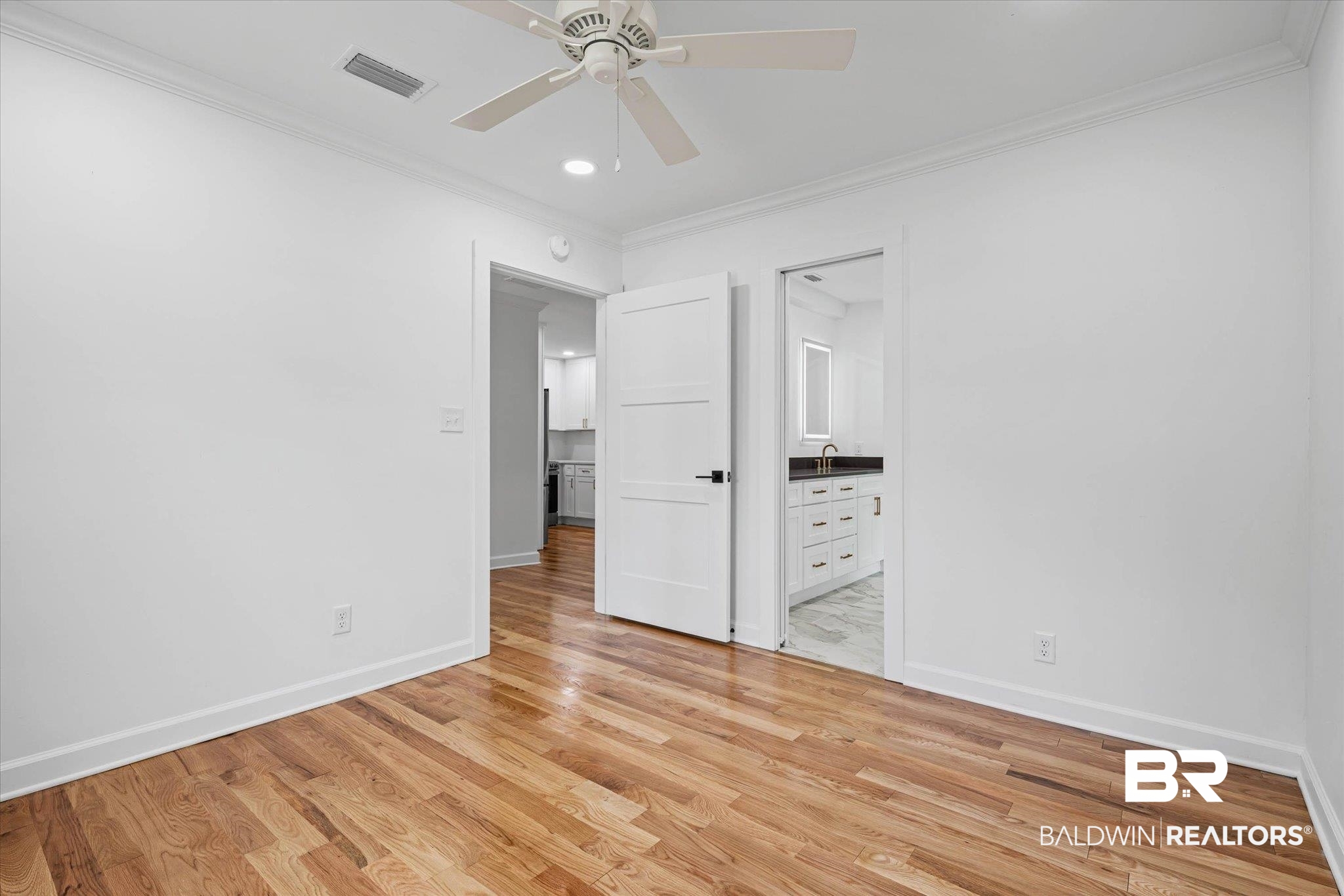 41 Hathaway Road West Mobile, AL 36608 - Photo 10 of 24 Unfurnished bedroom with ornamental molding, light wood-style floors, a ceiling fan, recessed lighting, and connected bathroom