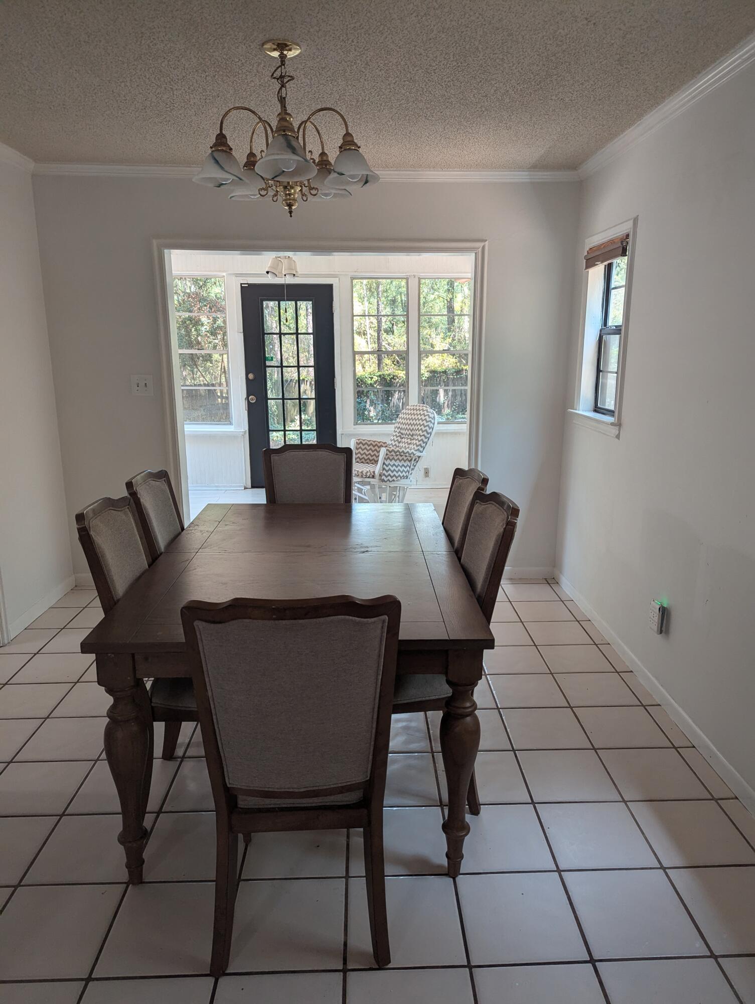 215 Ridge Lake Road Crestview, FL 32536 - Photo 3 of 21 a view of a dining room with furniture and window