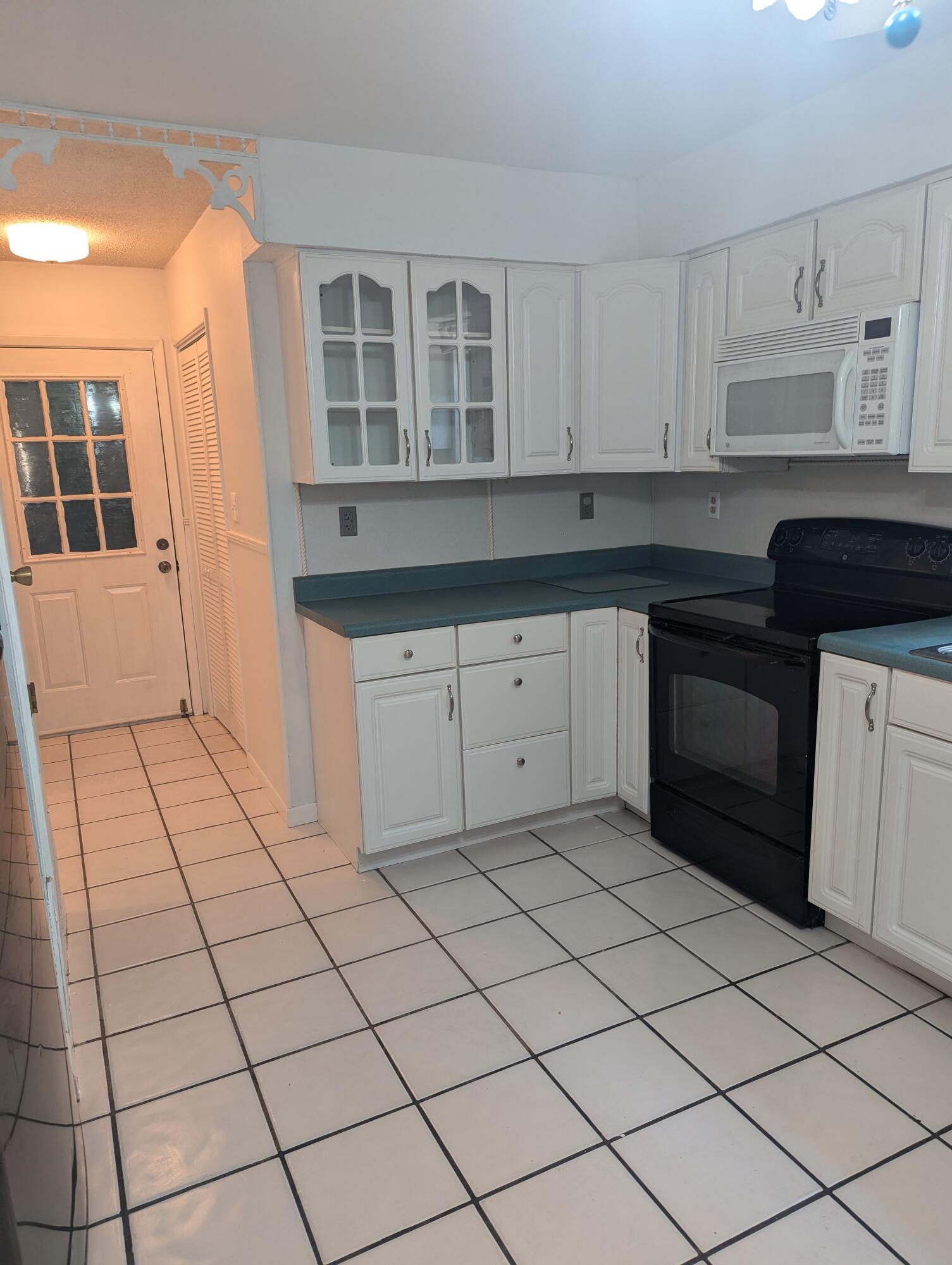 215 Ridge Lake Road Crestview, FL 32536 - Photo 6 of 21 a kitchen with a sink and cabinets