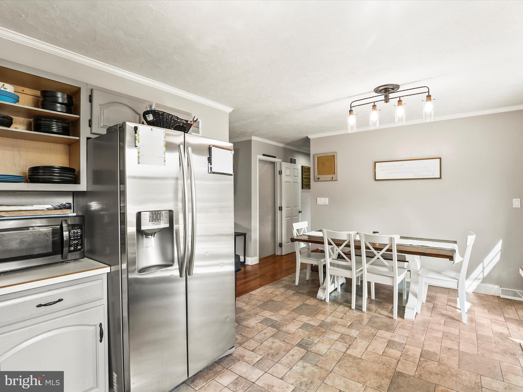 1360 Grandview Road Hanover, PA 17331 - Photo 17 of 36 a kitchen with stainless steel appliances a refrigerator and a dining table