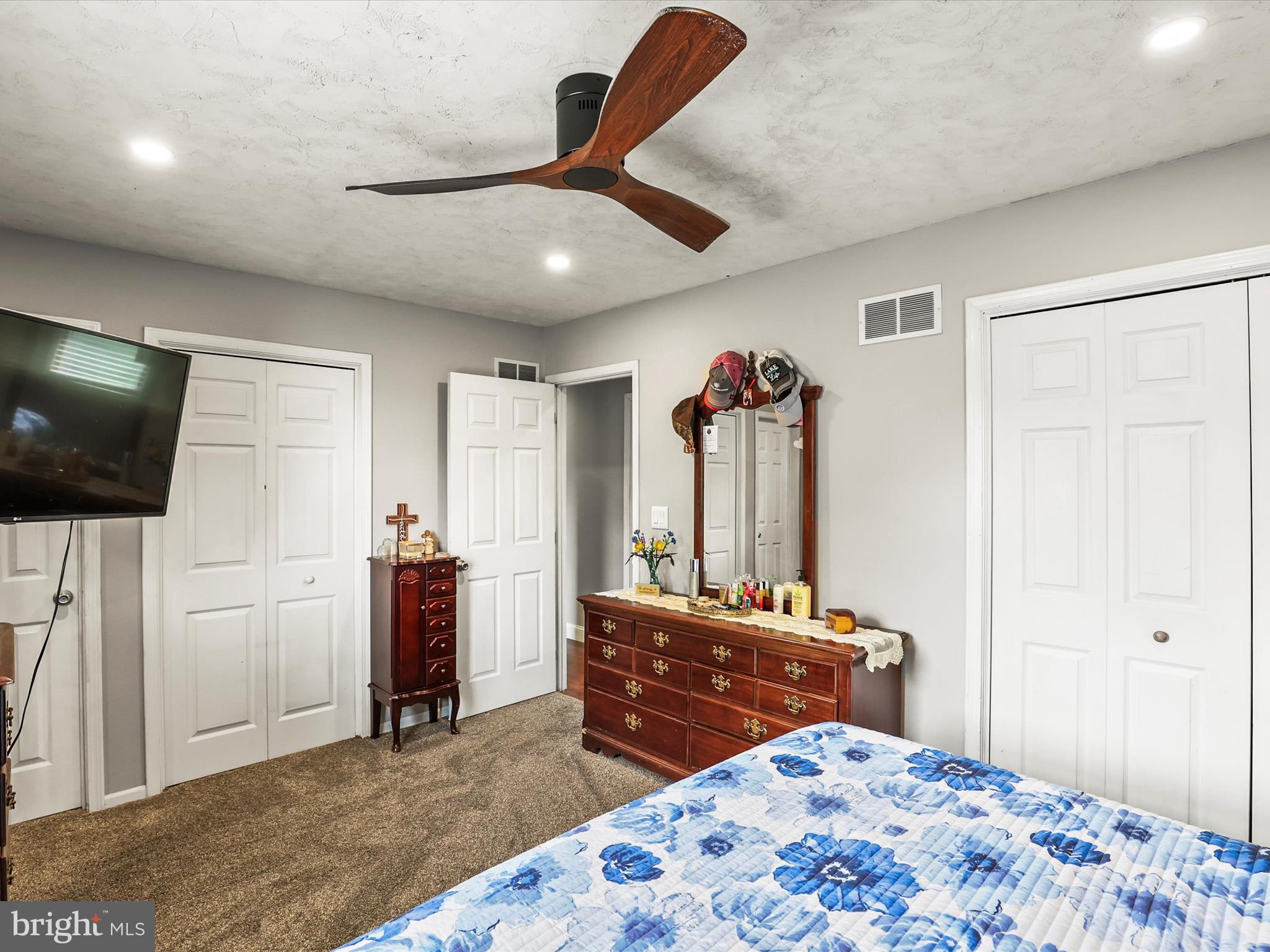 1360 Grandview Road Hanover, PA 17331 - Photo 21 of 36 a bedroom with a bed and a flat screen tv