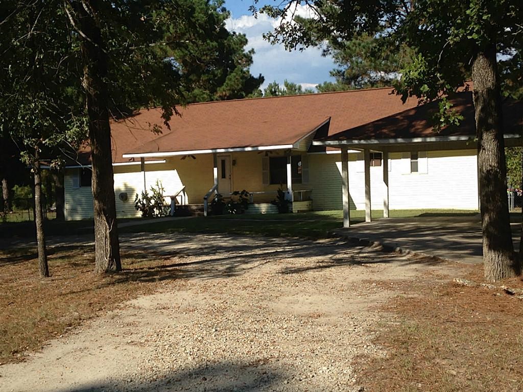 420 Mangum Road Livingston, TX 77351 - Photo 1 of 36 a view of a house with a yard
