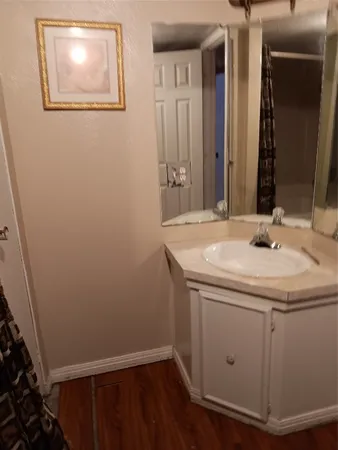 a bedroom with bed and a chandelier
