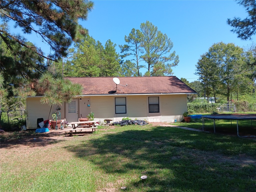 420 Mangum Road Livingston, TX 77351 - Photo 30 of 36 a front view of house with yard having outdoor seating