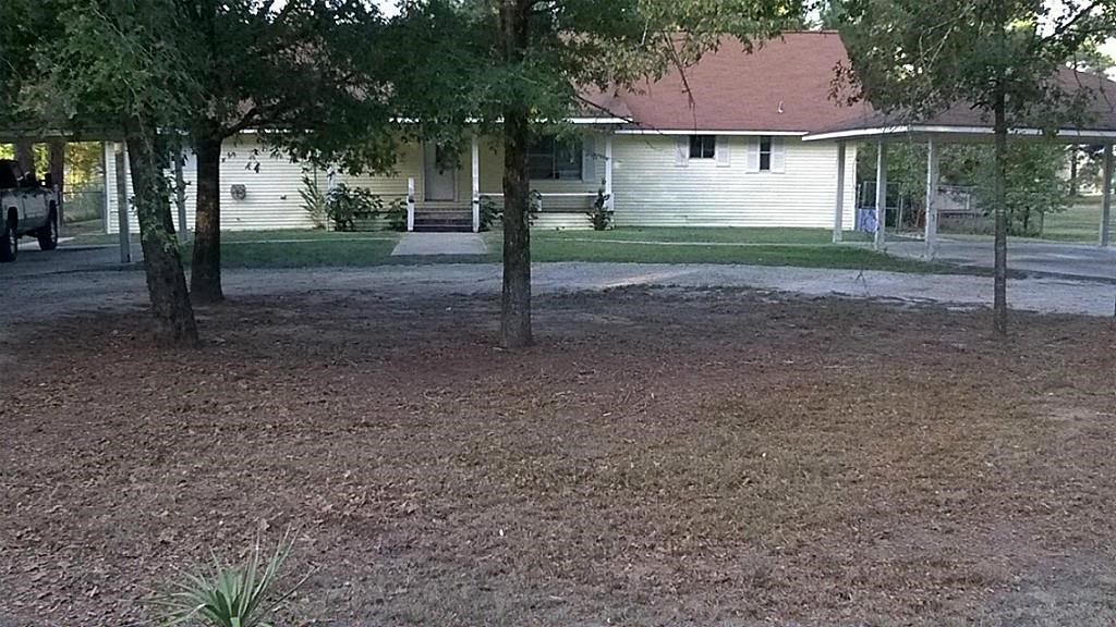 420 Mangum Road Livingston, TX 77351 - Photo 3 of 36 a view of a house with a yard and tree s