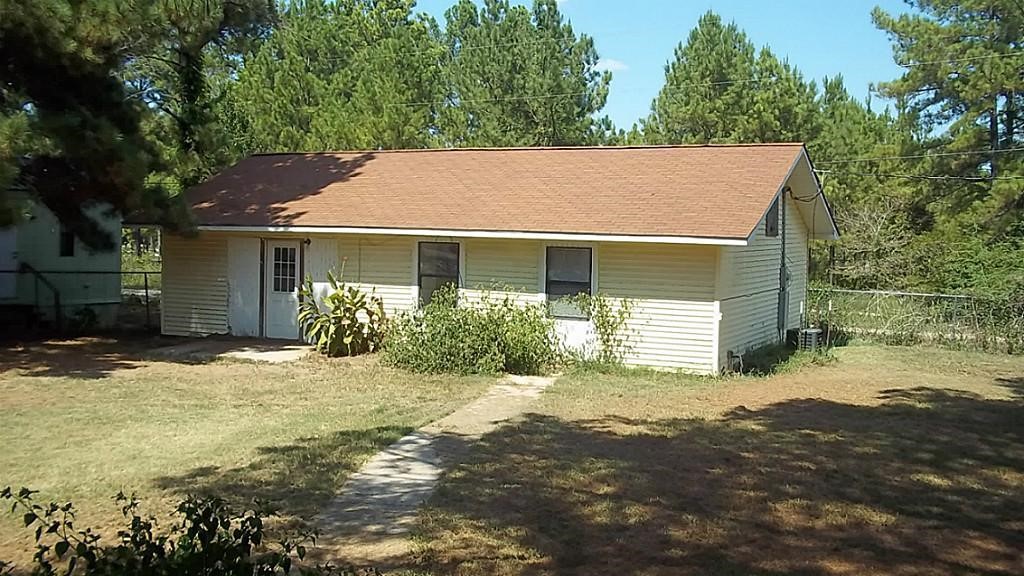 420 Mangum Road Livingston, TX 77351 - Photo 32 of 36 a view of a house with a yard