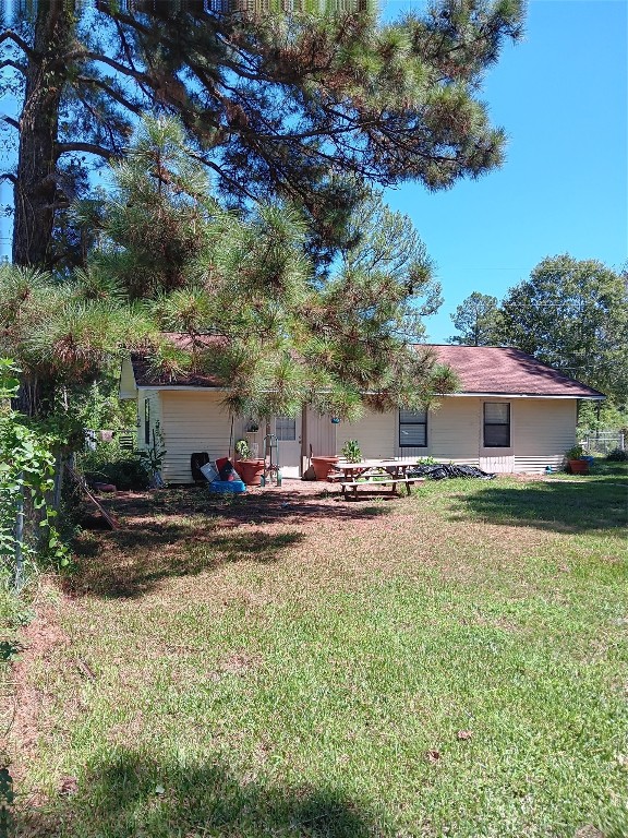 420 Mangum Road Livingston, TX 77351 - Photo 35 of 36 a view of a house with backyard and sitting area