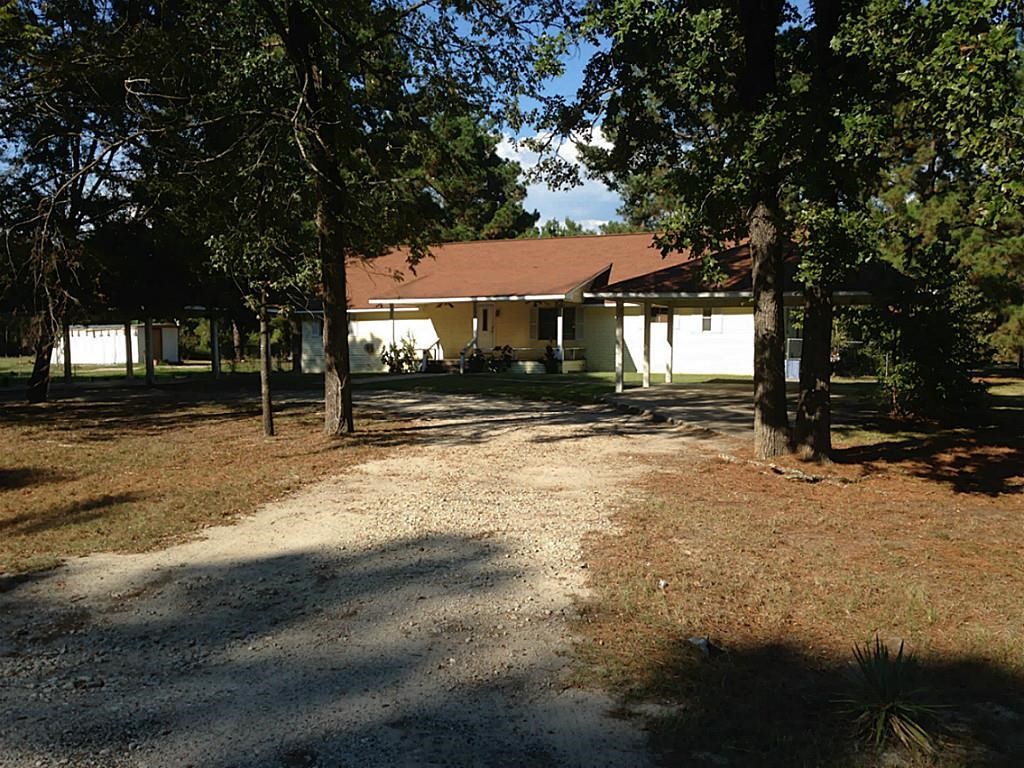 420 Mangum Road Livingston, TX 77351 - Photo 5 of 36 a front view of a house with a yard