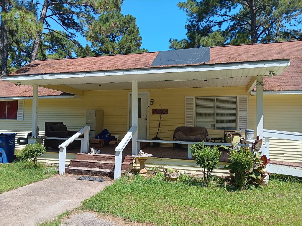 420 Mangum Road Livingston, TX 77351 - Photo 8 of 36 a view of house with a yard and sitting area