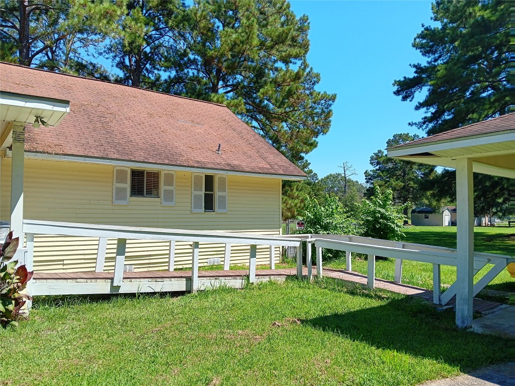 420 Mangum Road Livingston, TX 77351 - Photo 9 of 36 a view of a house with a yard