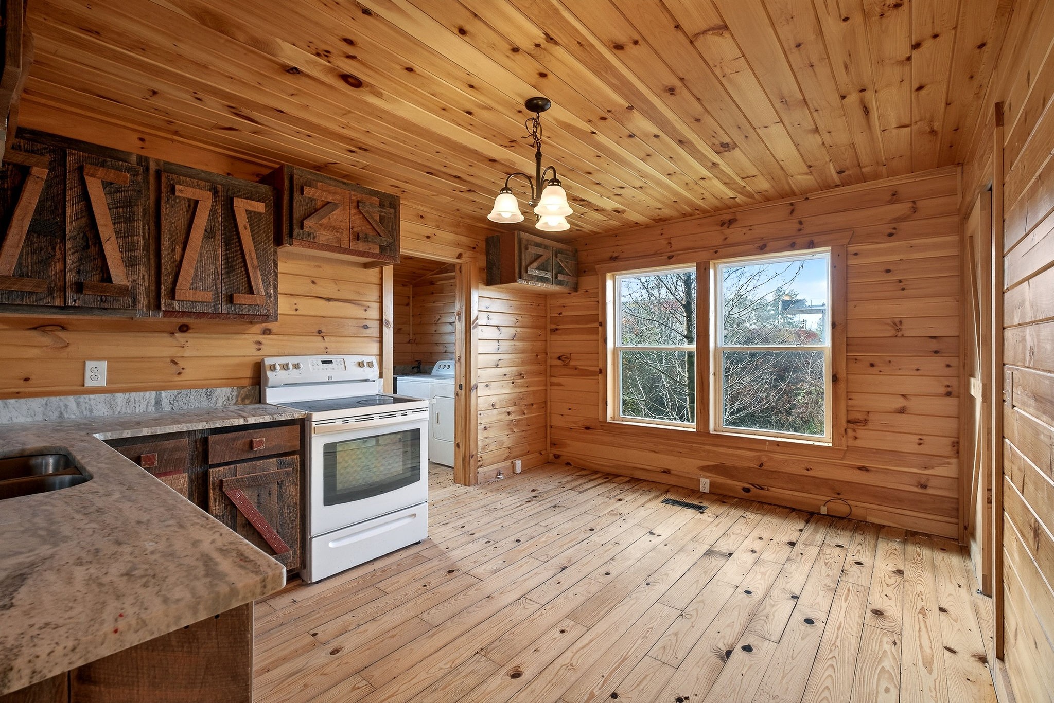6425 Plateau Road Crossville, TN 38571 - Photo 11 of 42 a kitchen with wooden floors and sink