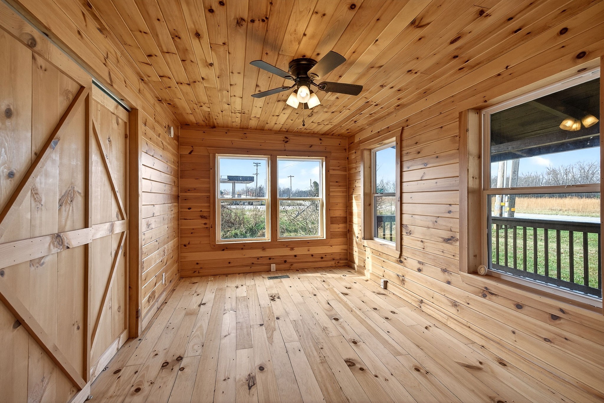 6425 Plateau Road Crossville, TN 38571 - Photo 15 of 42 a view of an empty room with wooden floor and a window