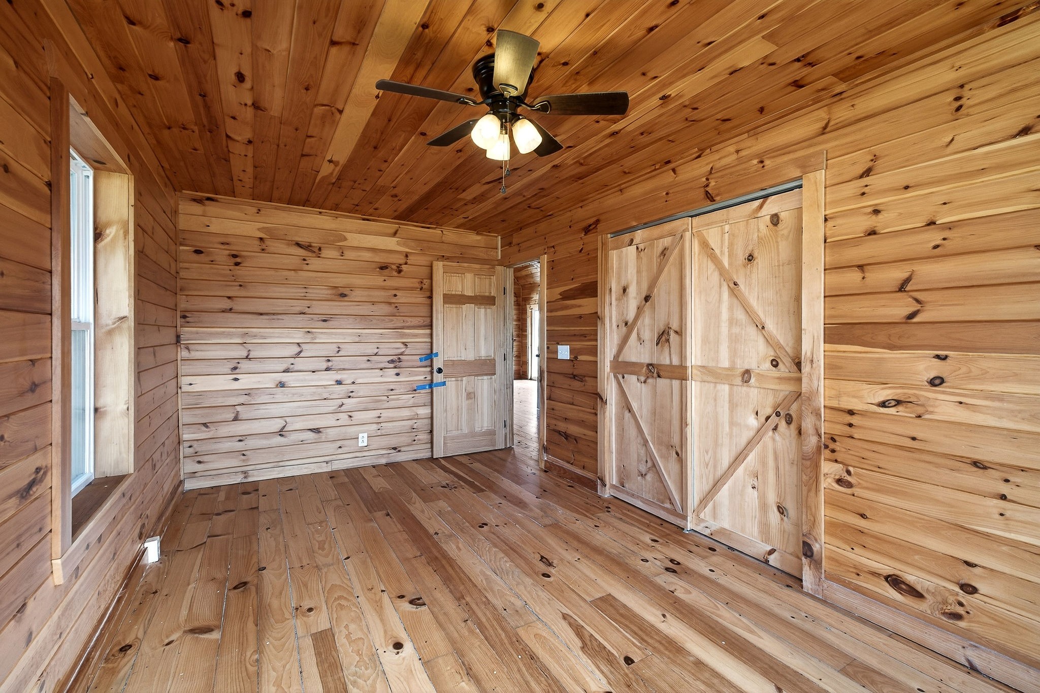 6425 Plateau Road Crossville, TN 38571 - Photo 16 of 42 a view of walk in closet with wooden floor